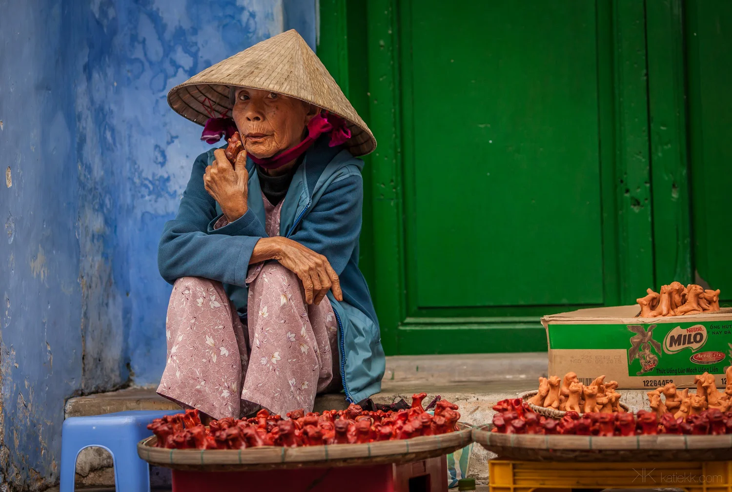 Vietnam, December 2014. It was a stormy day in Hoi An. It was raining non stop but as I couldn’t do anything about it, these were the cards given to me… I went on exploring. This lady was selling whistles to few crazy tourists walking around in this storm. I didn’t buy one and she wasn’t impressed with me taking a picture of her.