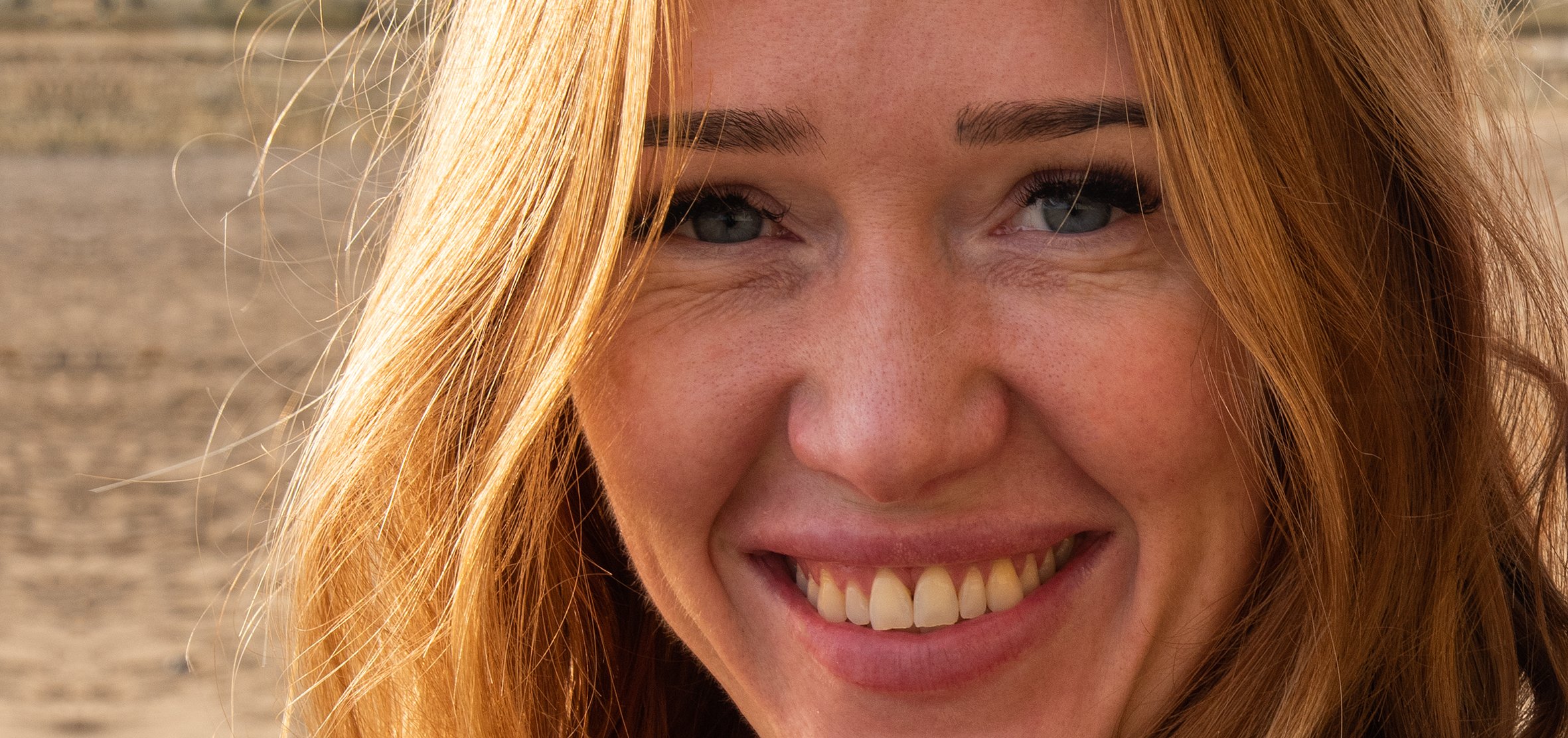 9799redheadsmilingonthebeachIYFpan30.jpg