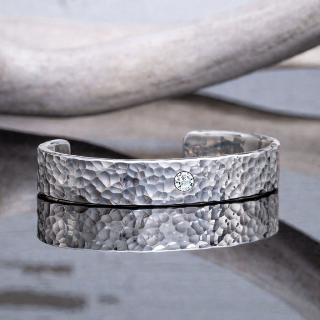 Shimmering silver cuff with diamond.png