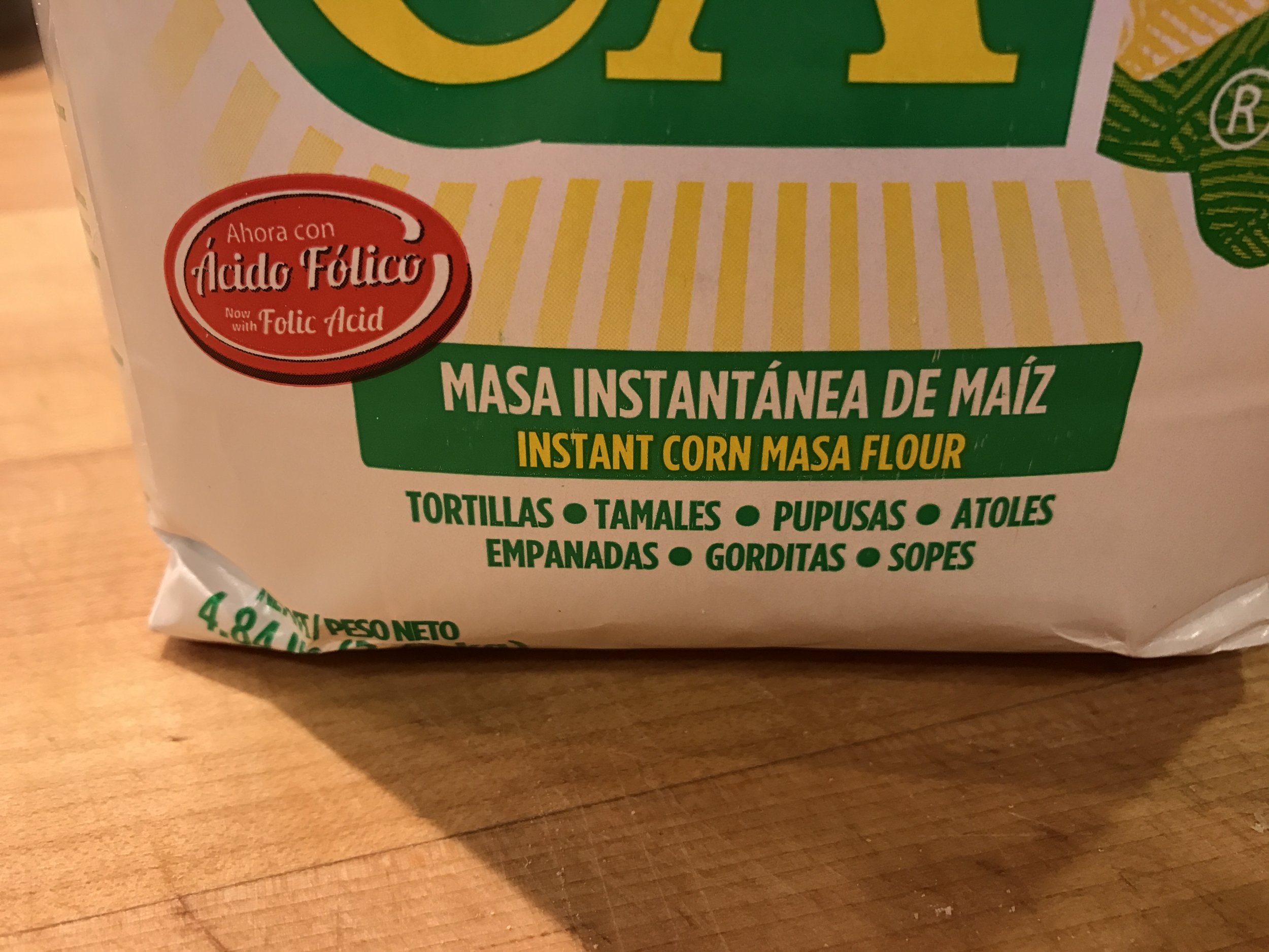 Masa marina (instant corn masa flour). This brand is Maseca, but that's not the only one out there.