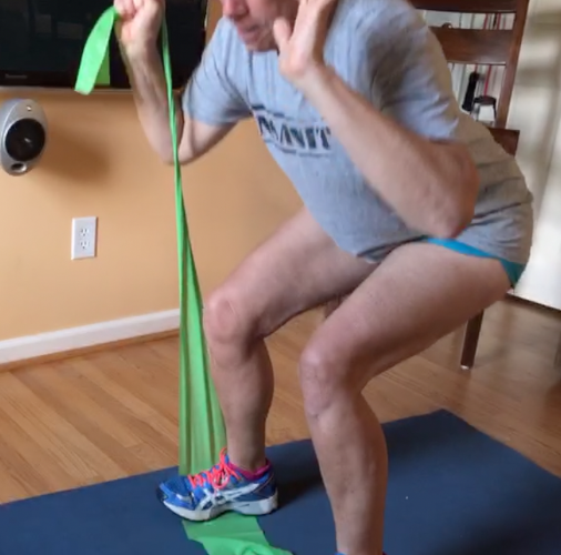 Squat with band under one foot