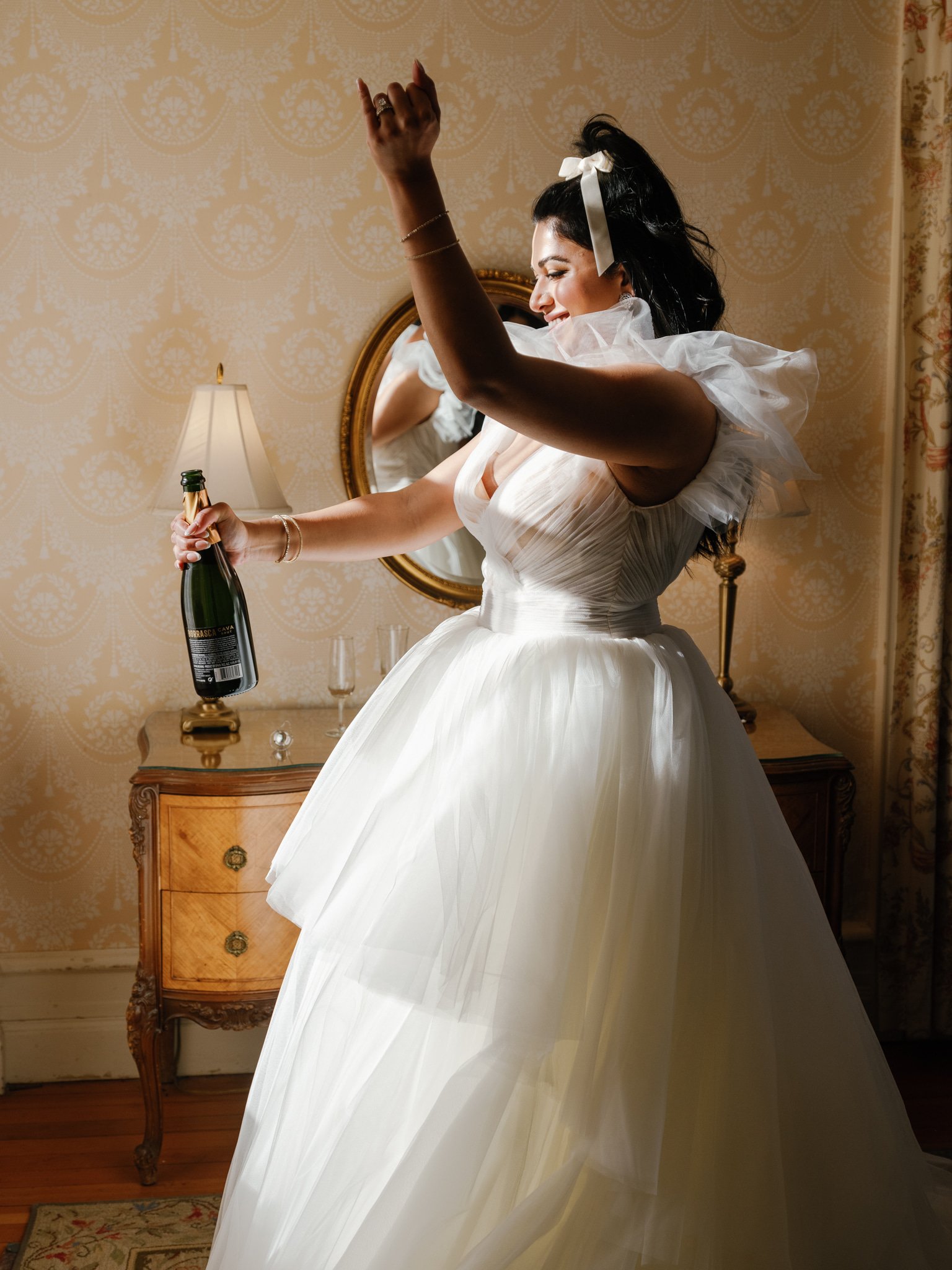 bride-champagne-pop-toast.jpg