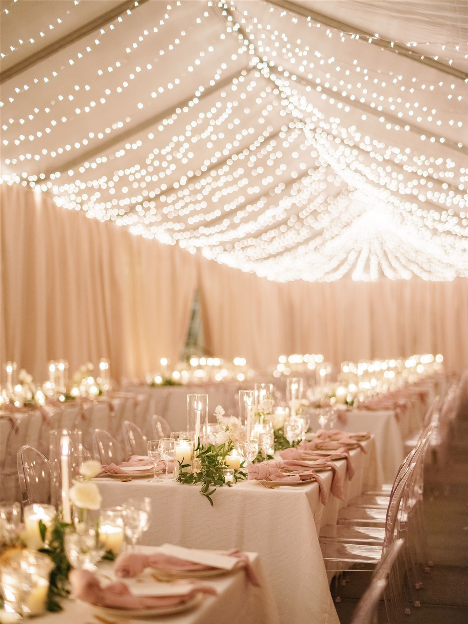 wedding-tent-long-tables-lights.jpg
