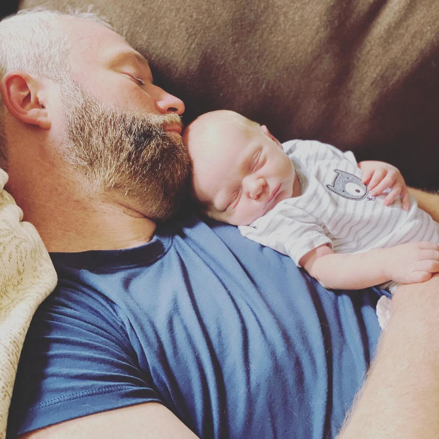 Mom&rsquo;s alright, but dad is my favorite bc he lets me take naps on him and watch rated R movies #todayitwasdiehard #likefatherlikeson #somedayillopenmyeyes