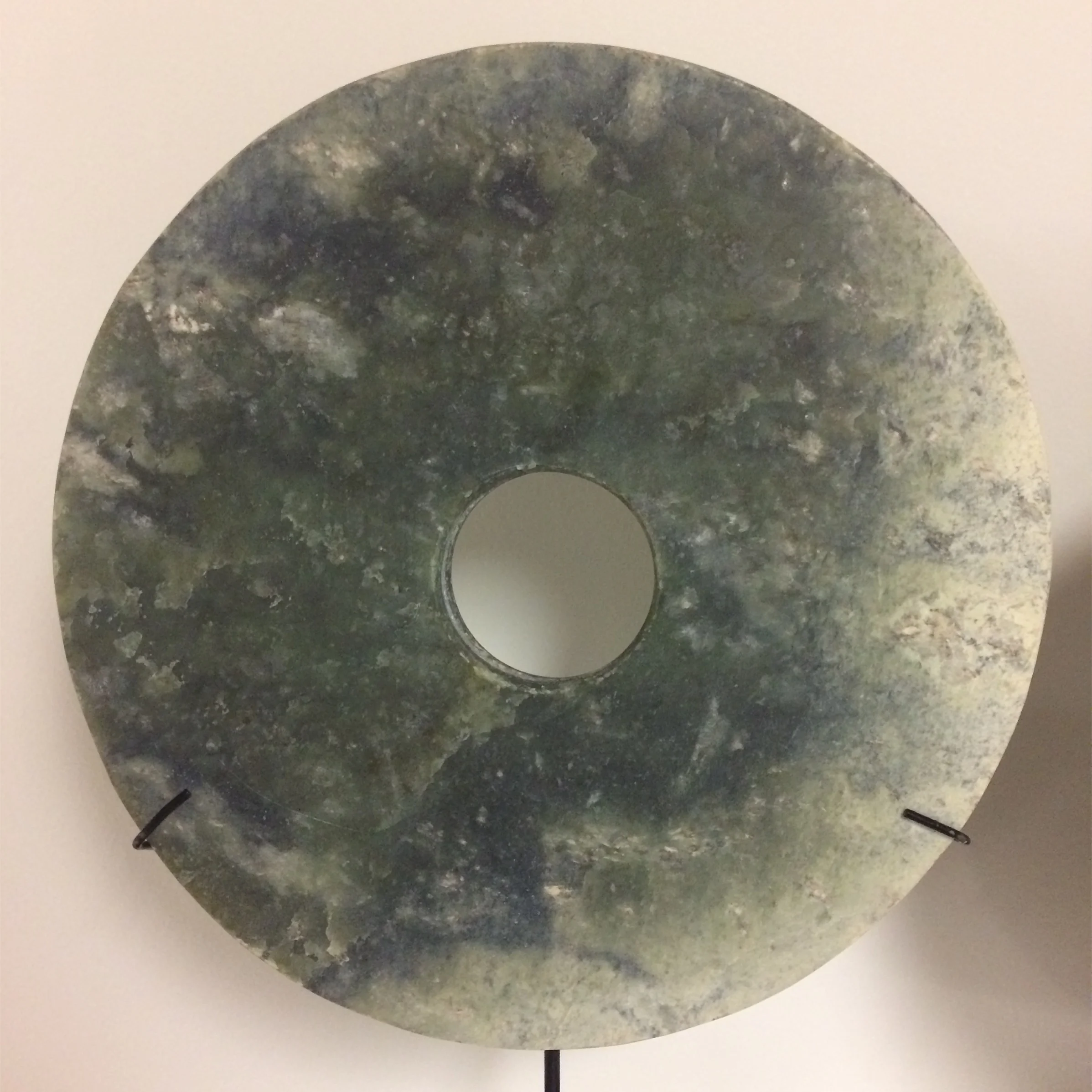  Bi disk Late Neolithic / Xia period, Attr. Qijia cultures of early china Ca. 2100-1600 BCE Jade Diameter: 8 ⅝ inches   