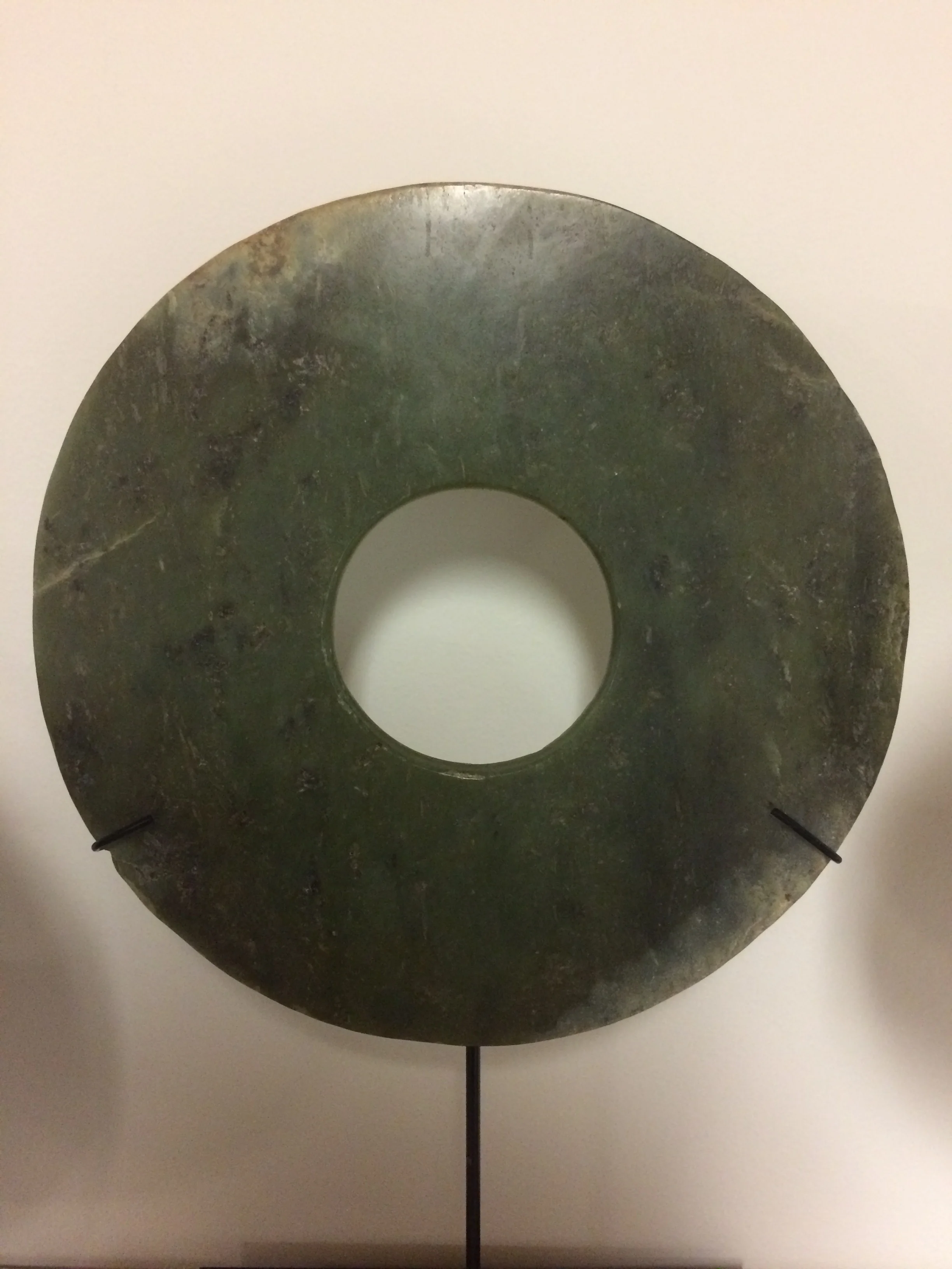  Bi disk Late Neolithic / Xia period, Attr. Qijia cultures of early china Ca. 2100-1600 BCE Jade Diameter: 8 ⅜ inches   