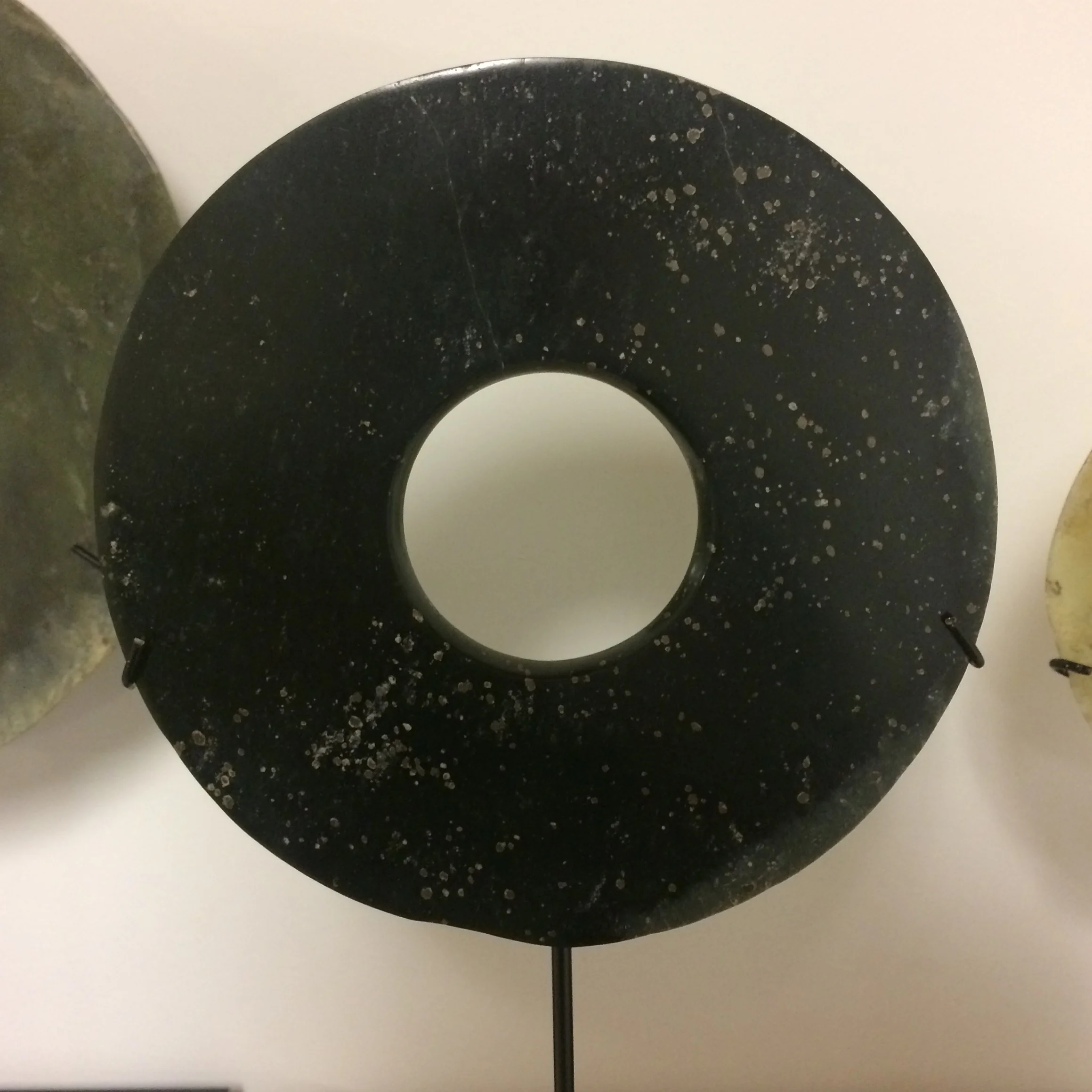  Bi disk Late Neolithic / Xia period, Attr. Qijia cultures of early china Ca. 2100-1600 BCE Jade Diameter: 6 ¼ inches   