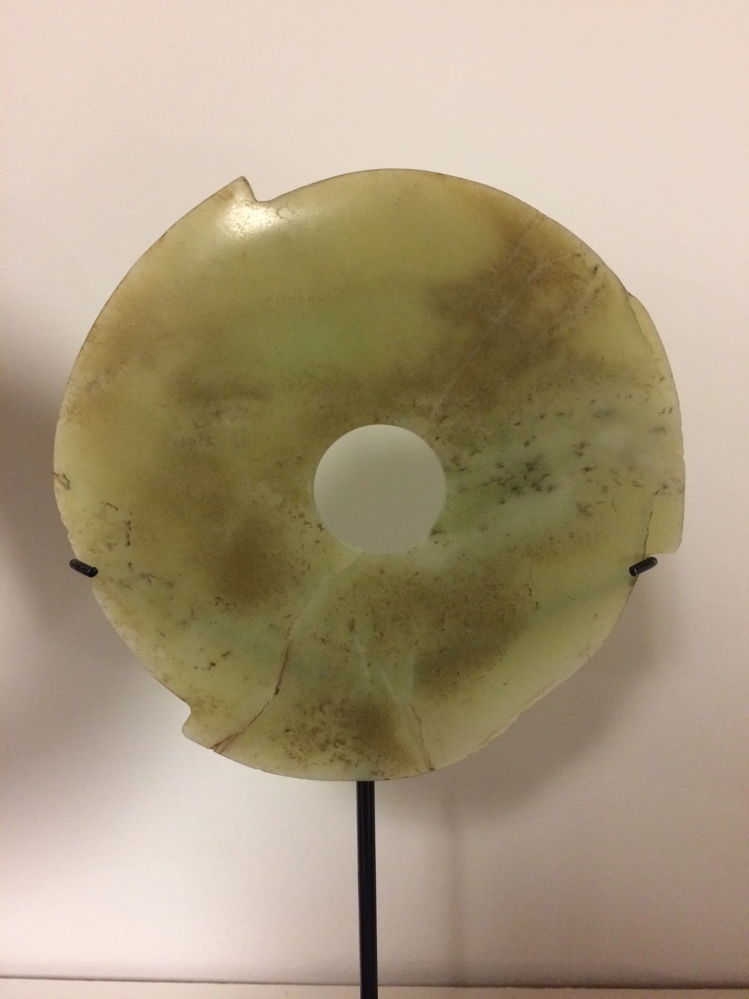 Bi disk Late Neolithic / Xia period, Attr. Qijia cultures of early china Ca. 2100-1600 BCE Jade Diameter: 4 ⅝ inches   