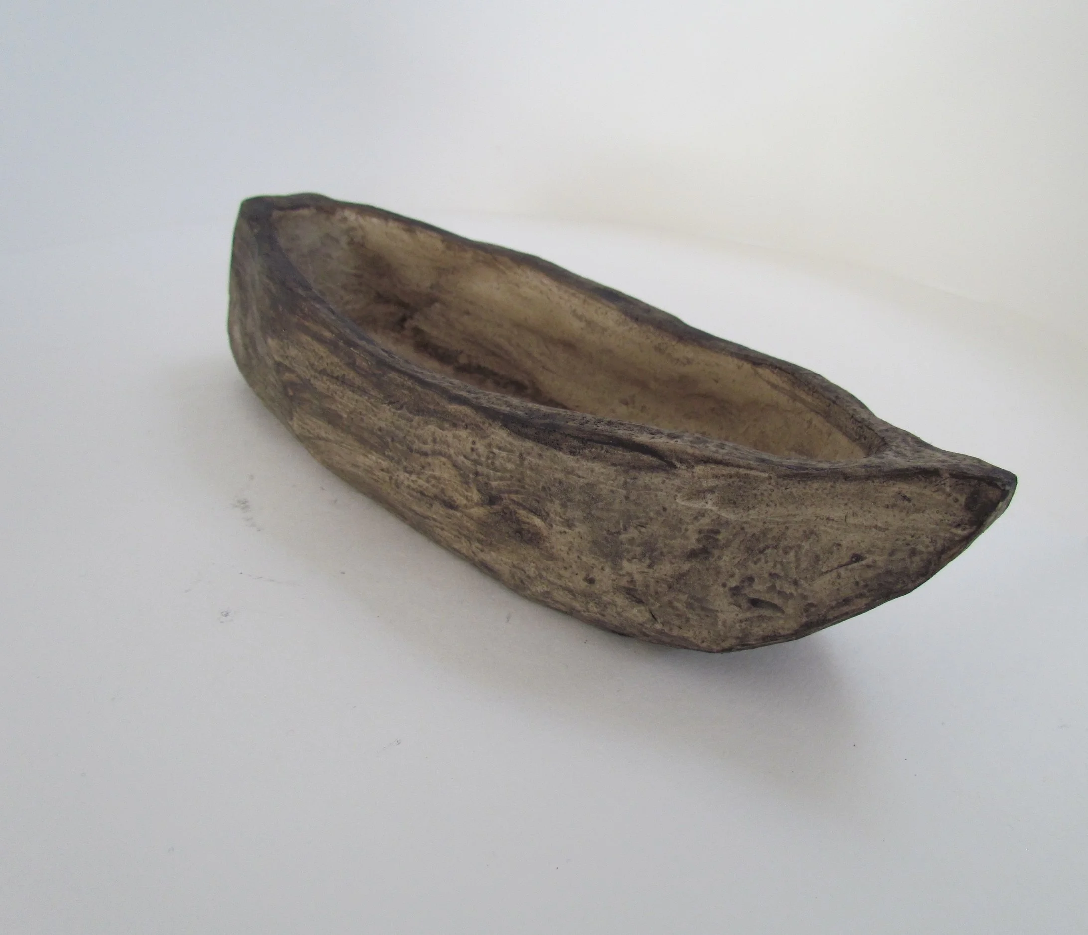 Ilona Pachler No. 11 Ship from in her command sailed 34 black hollow vessels Large walnut brown ship 10 x 3 ½ x 2 ¼ inches Clay and pigment 2018