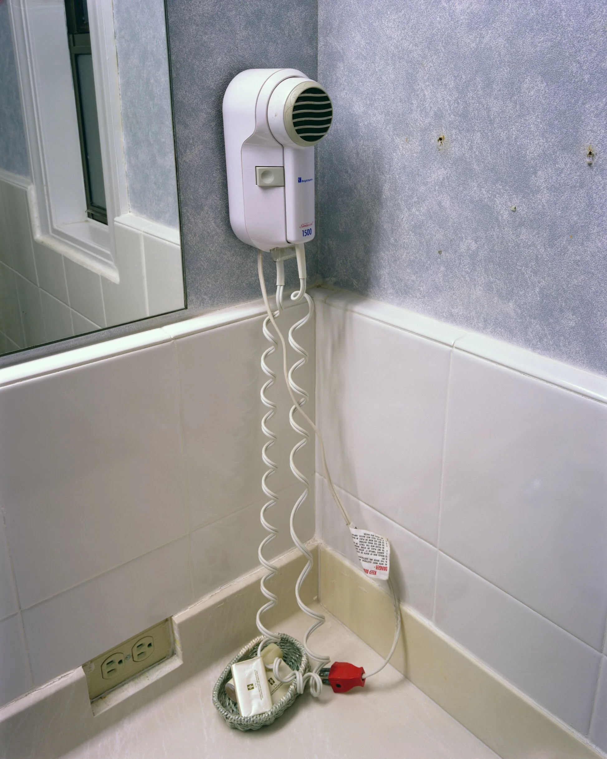  Eric Cousineau Hair dryer, Room 126 1 / 20 From American Motel Archival pigment print 17 x 22 inches 2010    
