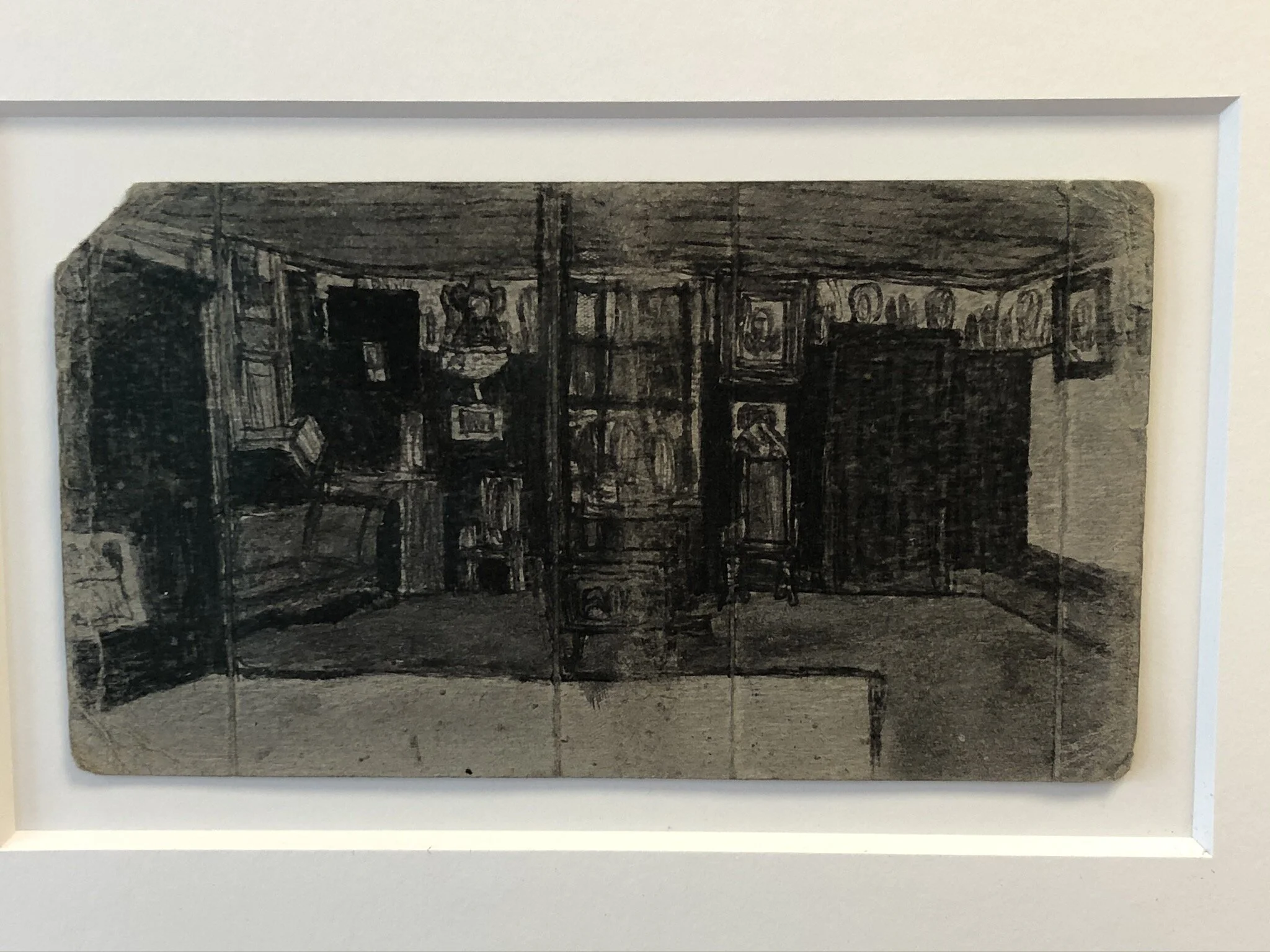  James Castle   Untitled (Interior with Stove, Framed Pictures)   n.d.   Soot and saliva on found paper   4 7/8 x 8 3/4 in  