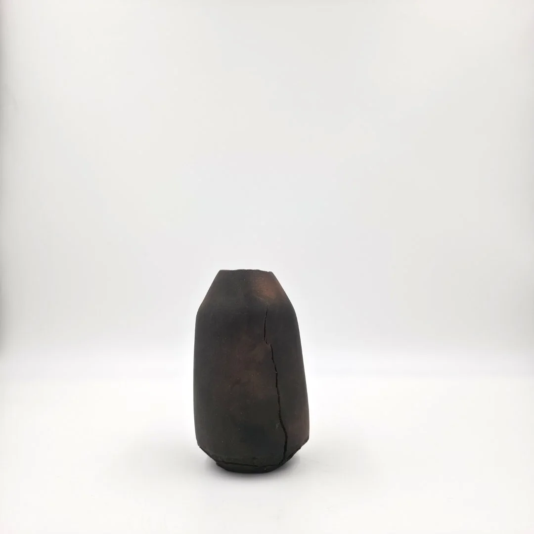  Johnny Ortiz-Concha (Dried flower vase - ‘To let the light in’ collection) Fired new moon 11.20.2025 6 x 3 ¼ inches&nbsp; wild pitfired micaceous clay, elk marrow, and beeswax    