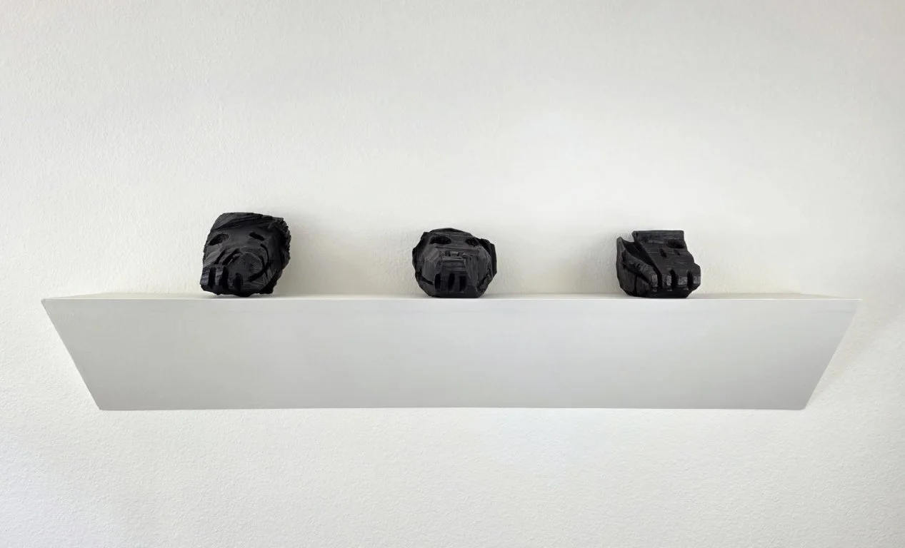  Marc Baseman three black dogs 2025&nbsp; 4 x 5 x 7 ea.&nbsp; Cedar and graphite    