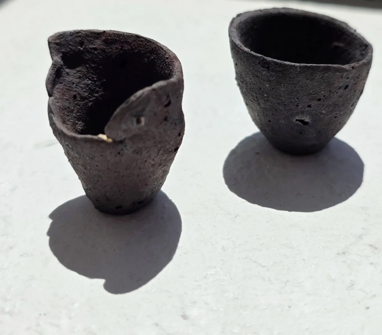  Utako Shindo from lines of sight  2023  1 ⅖ x 1 ¼ inches, 1 ¼ x 1 ¼ inches  set of stoneware vessels (toride clay, white slip) 