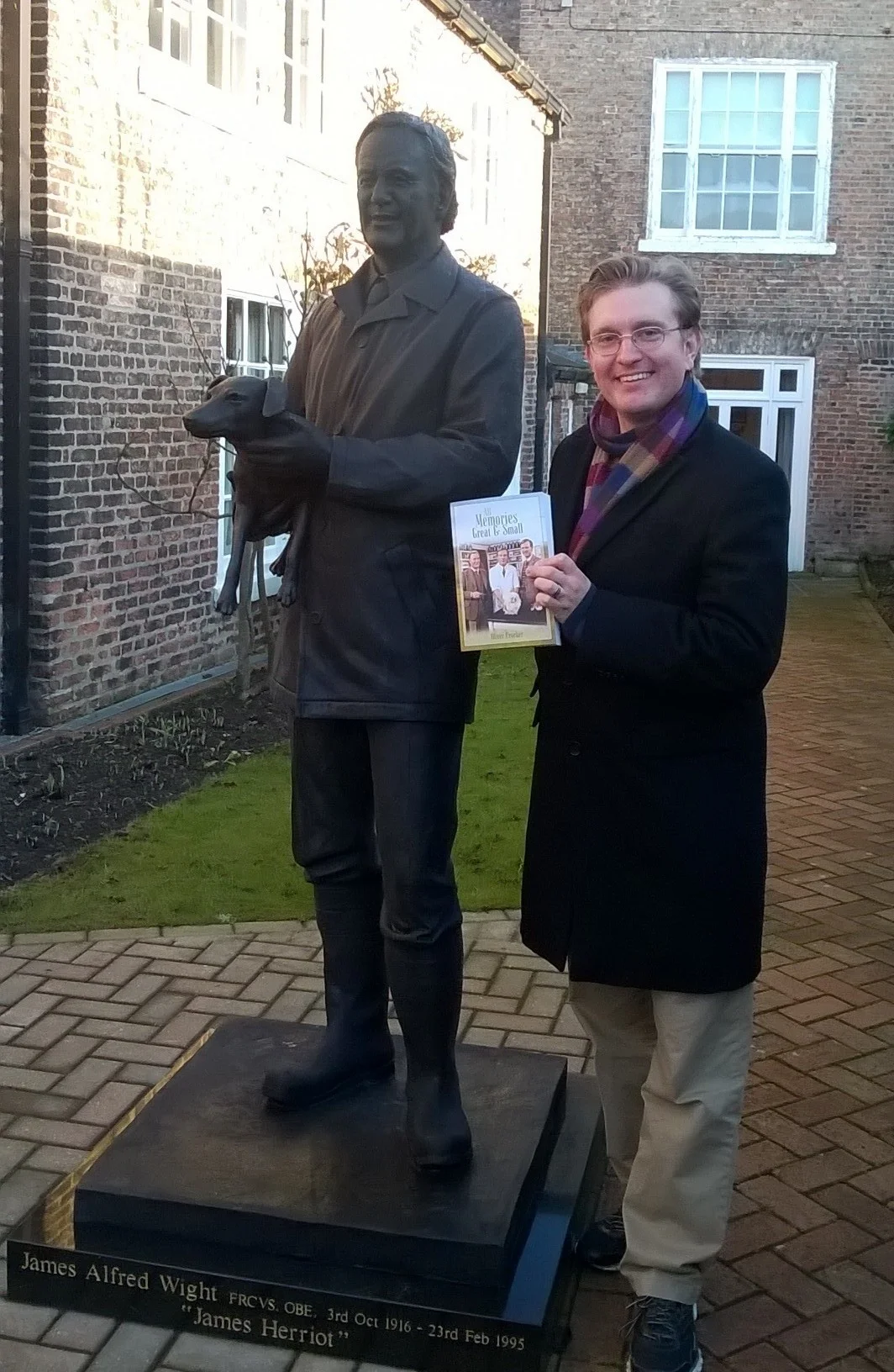 Author of All Memories Great and Small Oliver Crocker, pictured with the statue of Alf Wight (James Herriot) at The World of James Herriot Museum in Thirsk, North Yorkshire