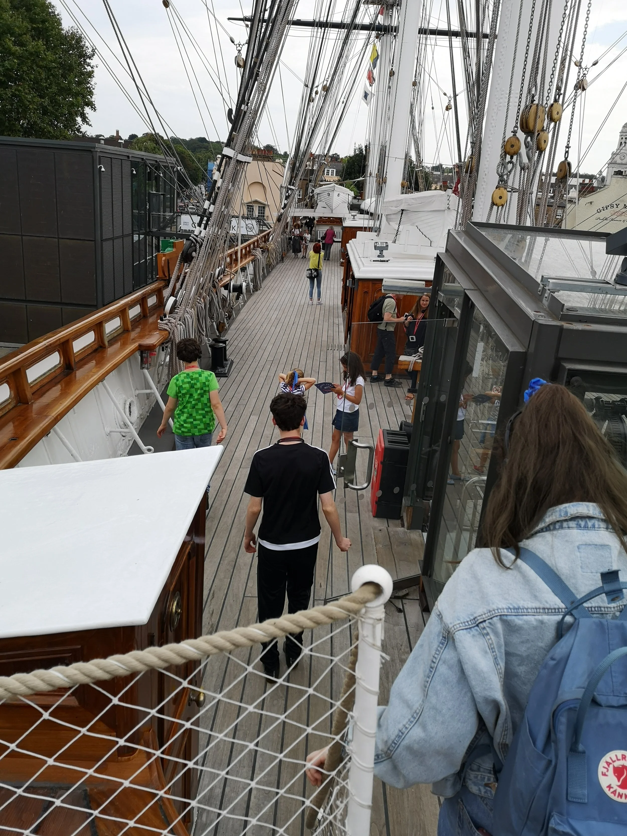 Exploring the upper deck of the Cutty Sark in Greenwich.