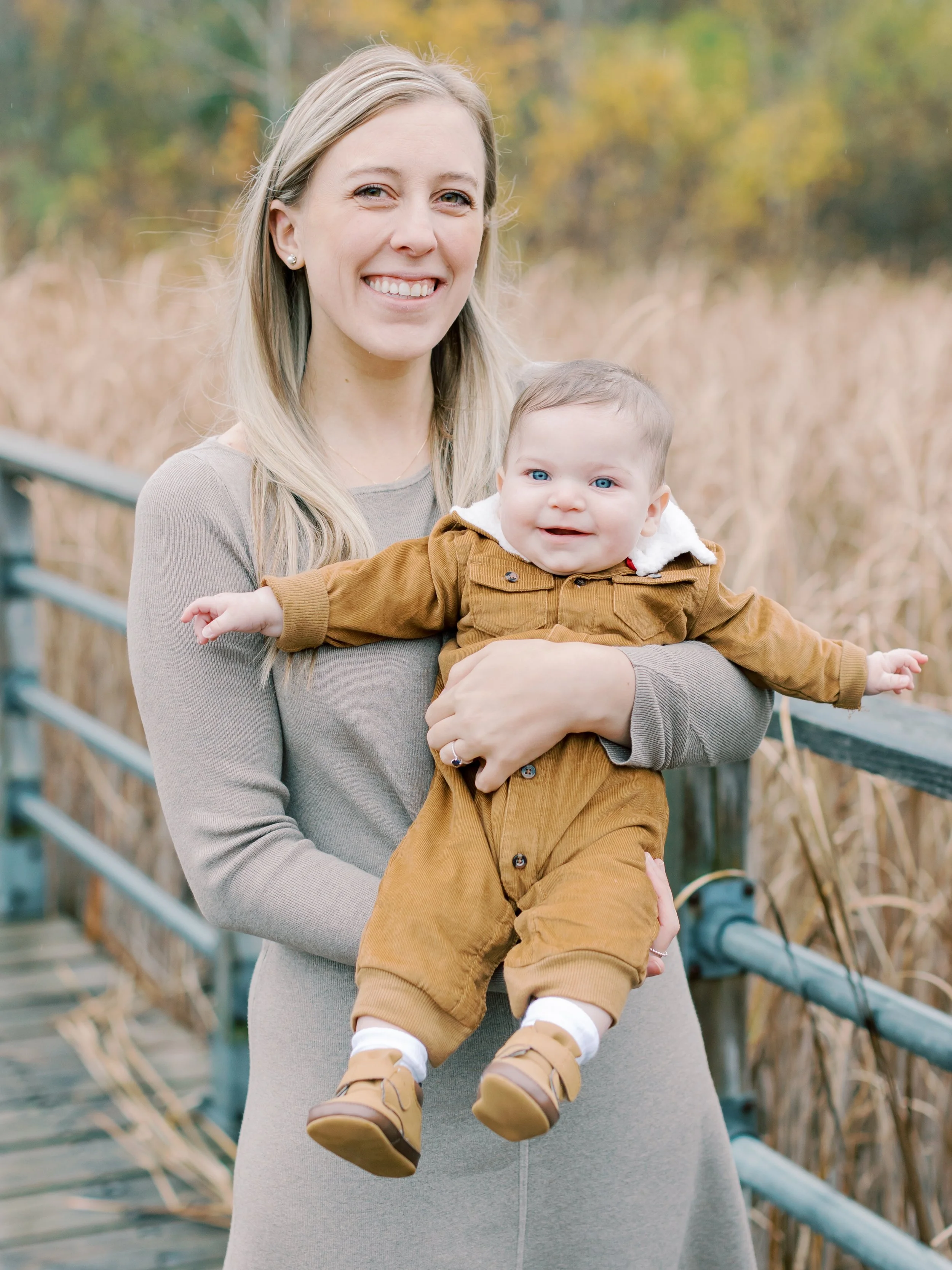 rainy fall family photos in Burlington mom dad and baby boy