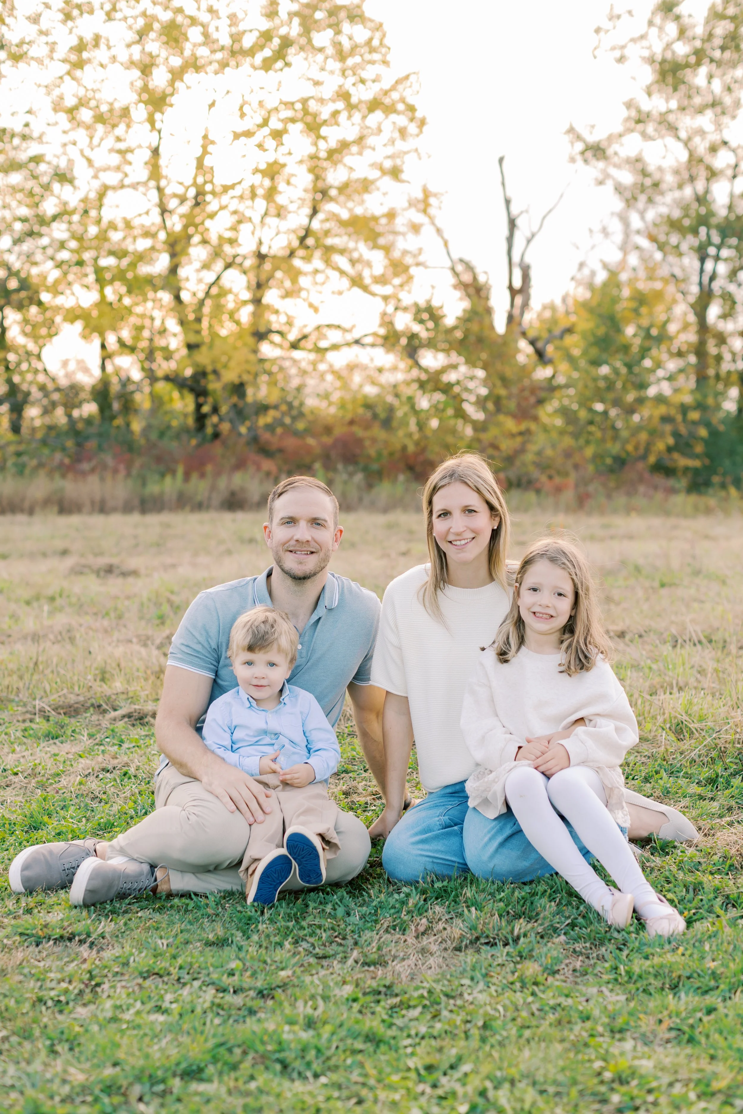 A family enjoying the sunset during a lifestyle session at Cityview Park with a top-rated family photographer in Burlington.