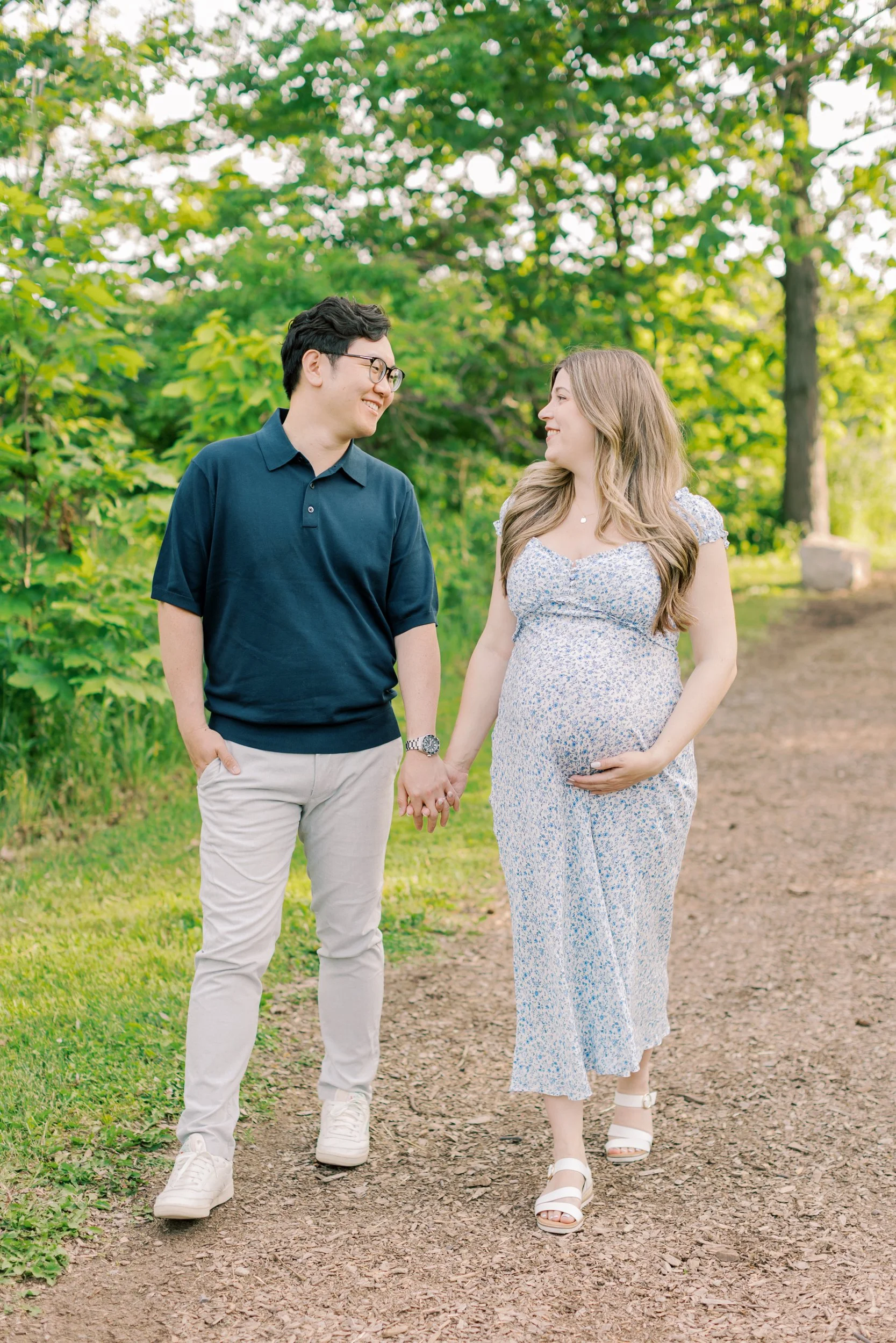 A family enjoying the sunset during a lifestyle session at Cityview Park with a top-rated family photographer in Burlington.