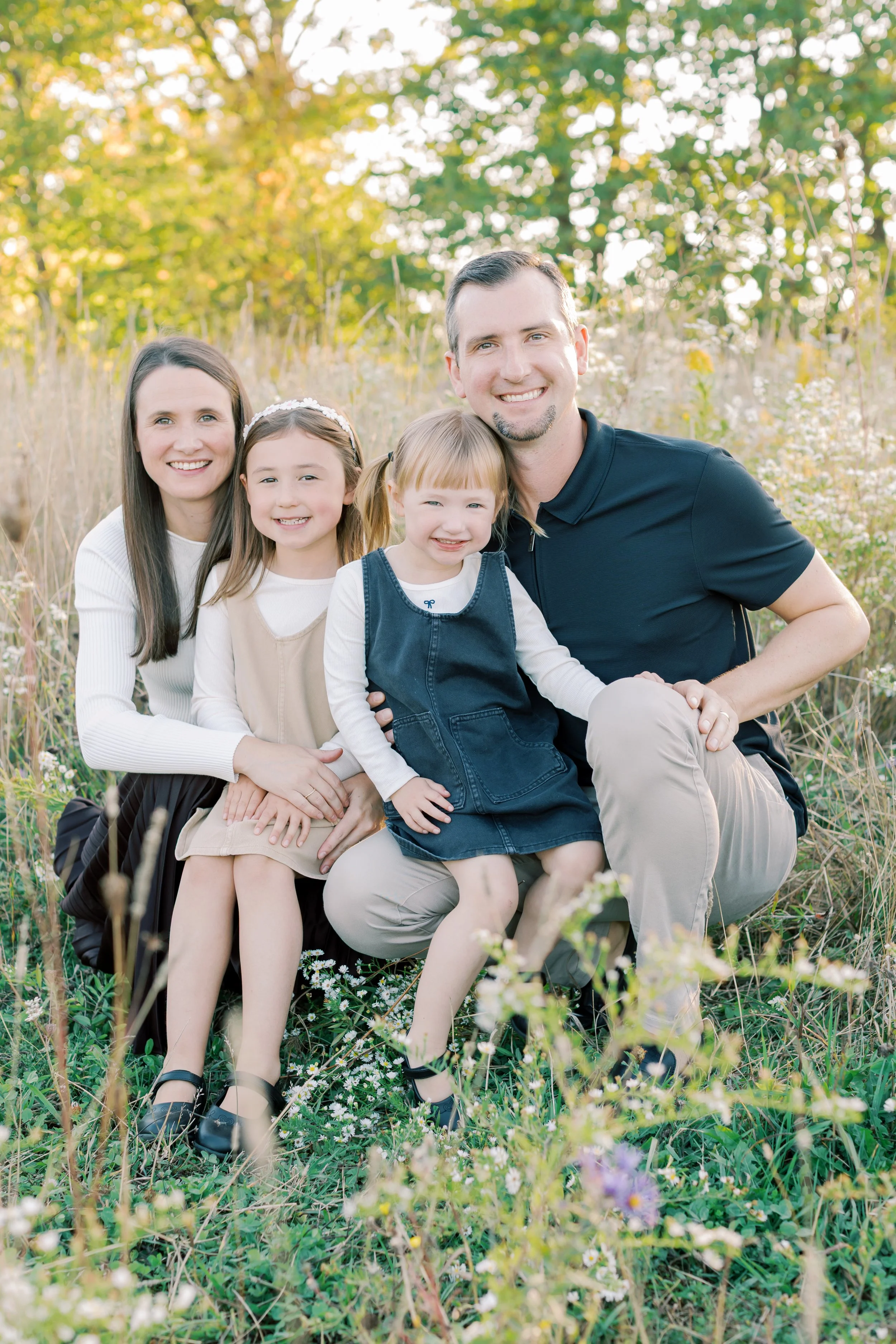 A family enjoying the sunset during a lifestyle session at Cityview Park with a top-rated family photographer in Burlington.