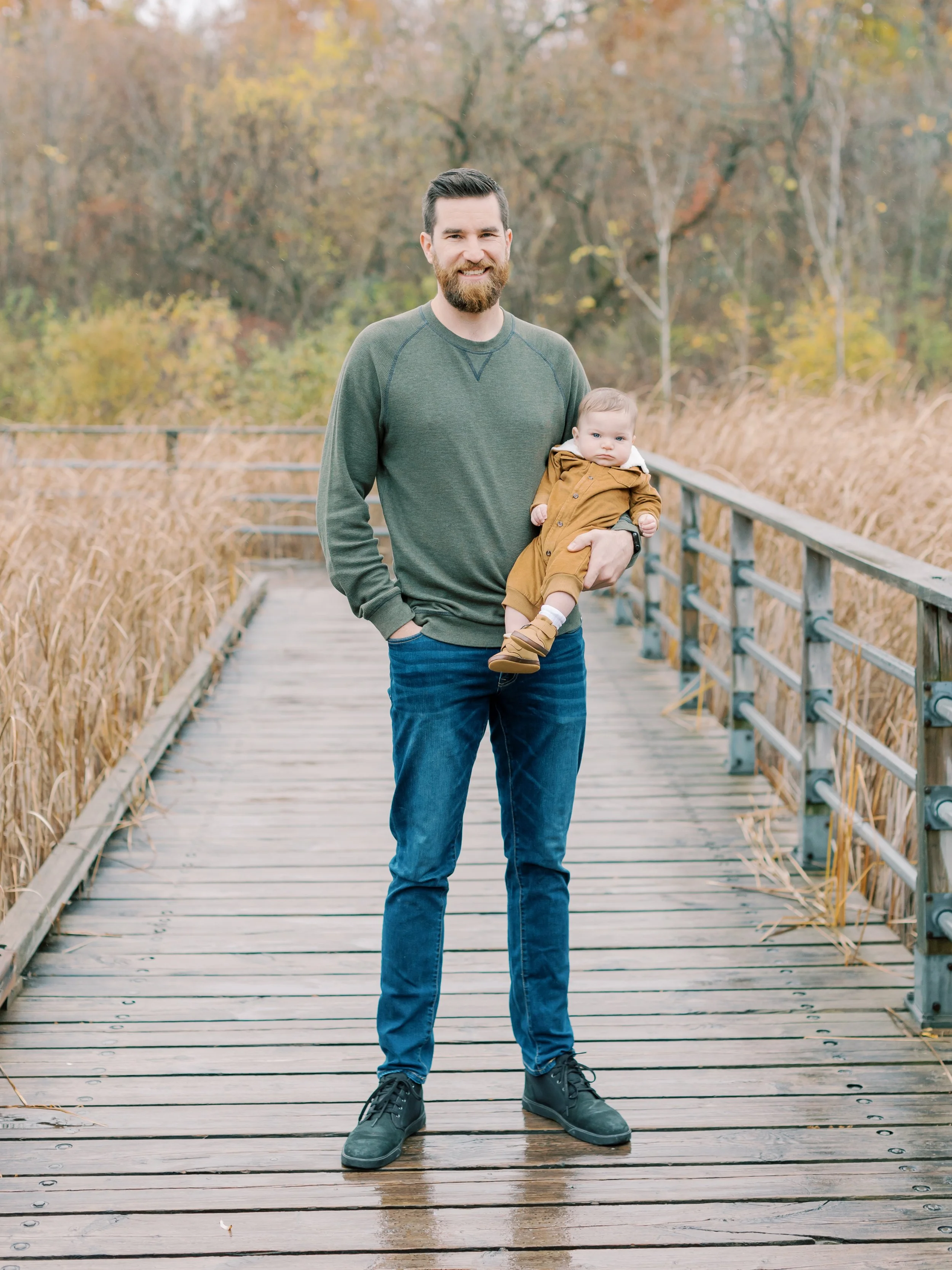 rainy fall family photos in Burlington mom dad and baby boy