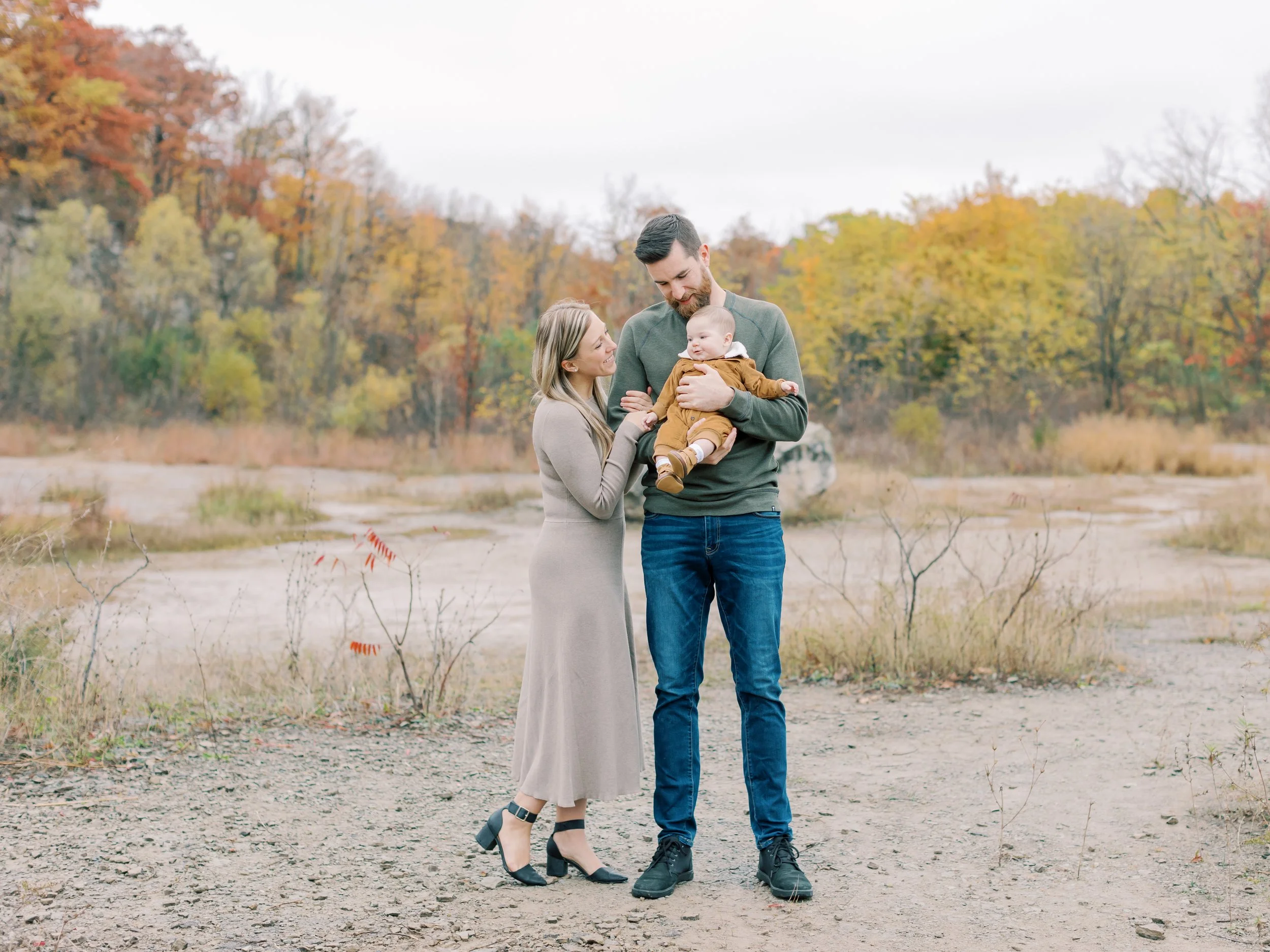rainy fall family photos in Burlington mom dad and baby boy