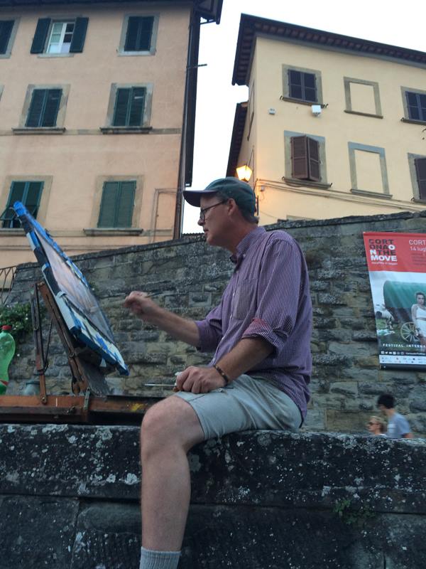 me painting on a wall in Cortona, Italy, 2016