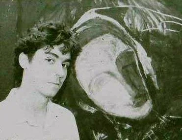 The young artist in college with large self portrait
