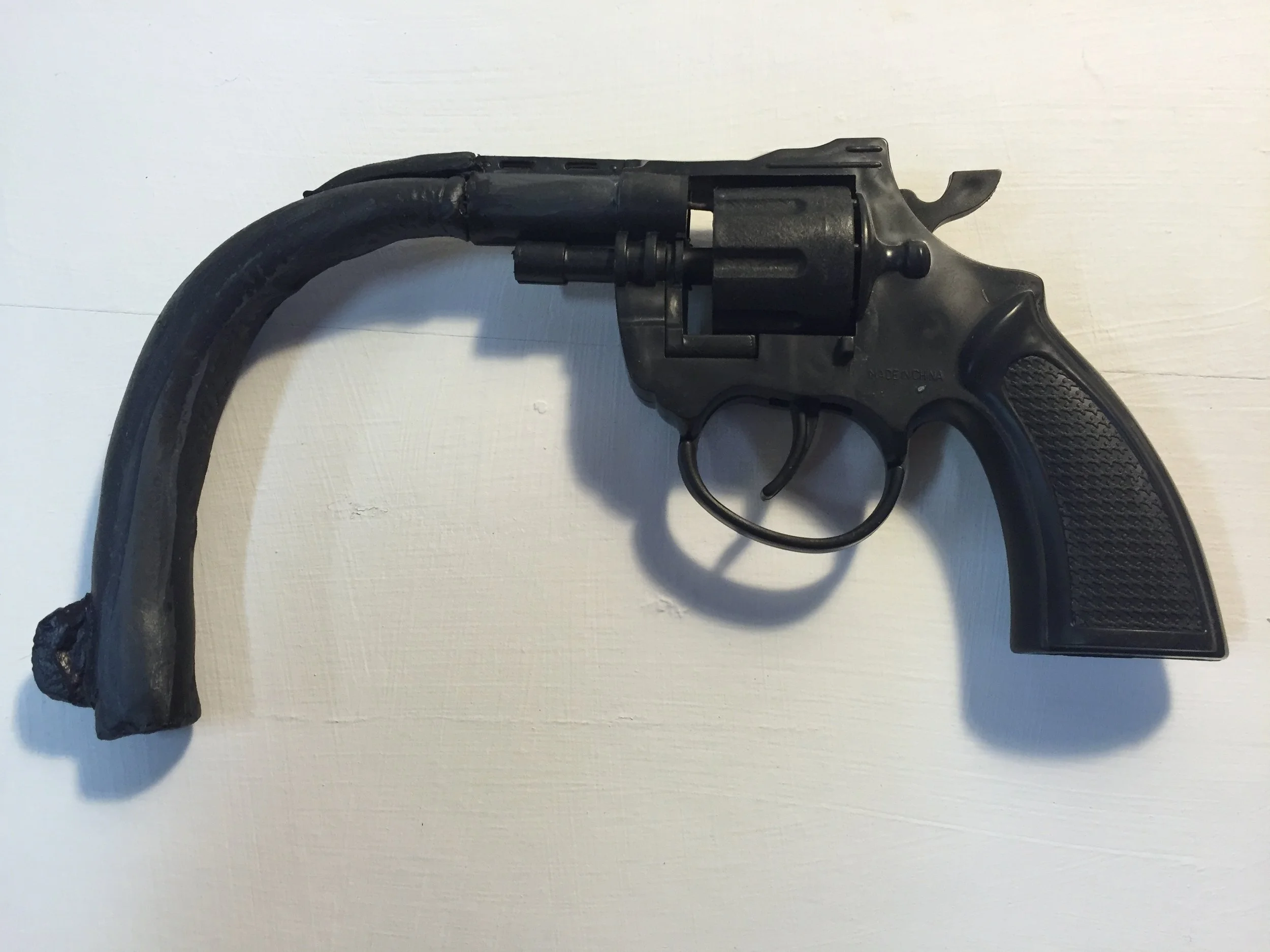 Flaccid-toy gun, clay,-10 by 4 inches-2016