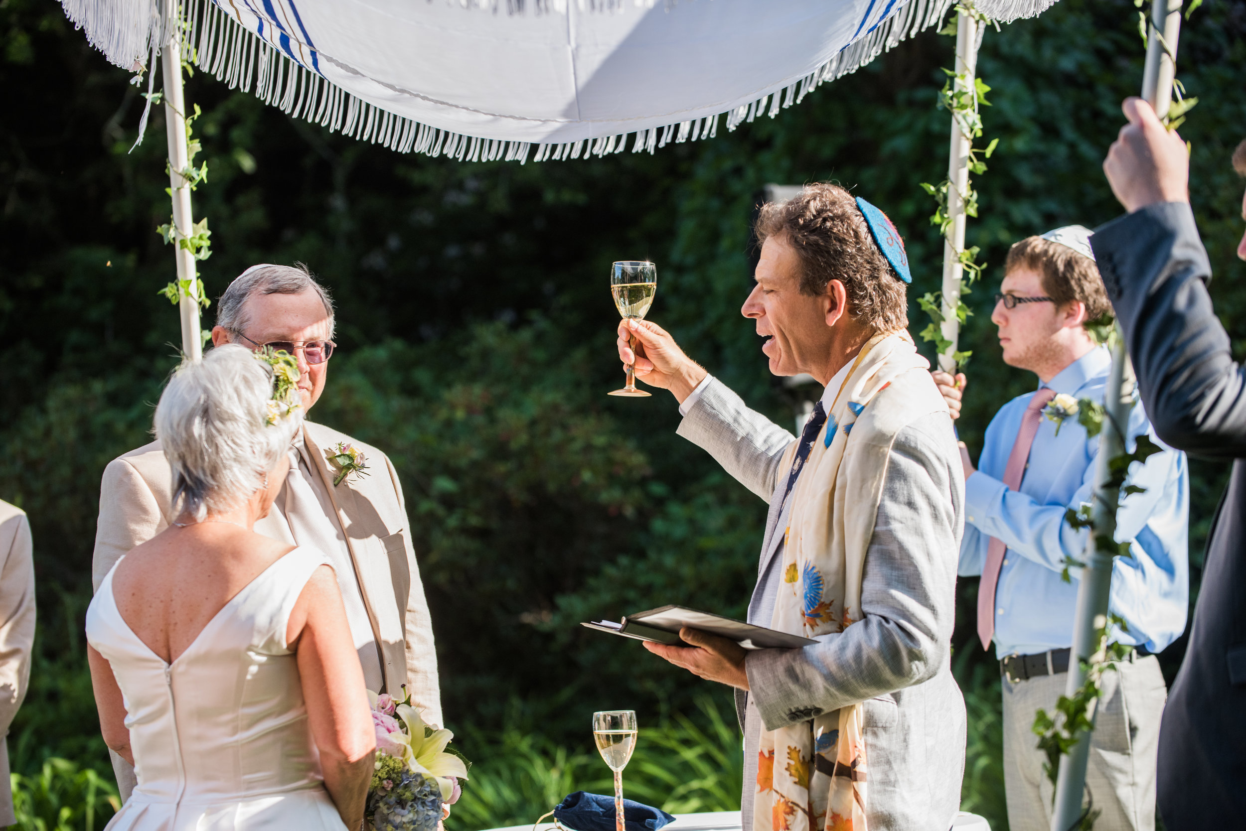 Sherri Wedding Under the Chuppah with Wine Glass.jpg