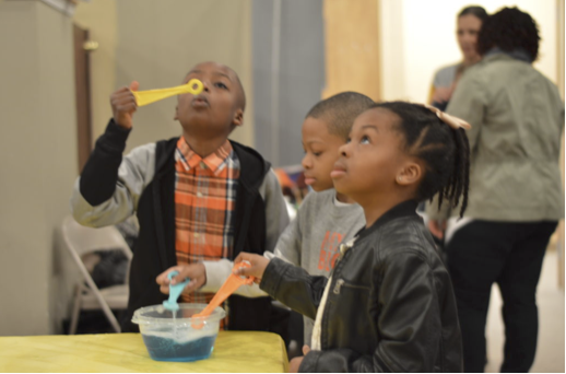 Children blowing bubbles, Public Charter school in Atlanta