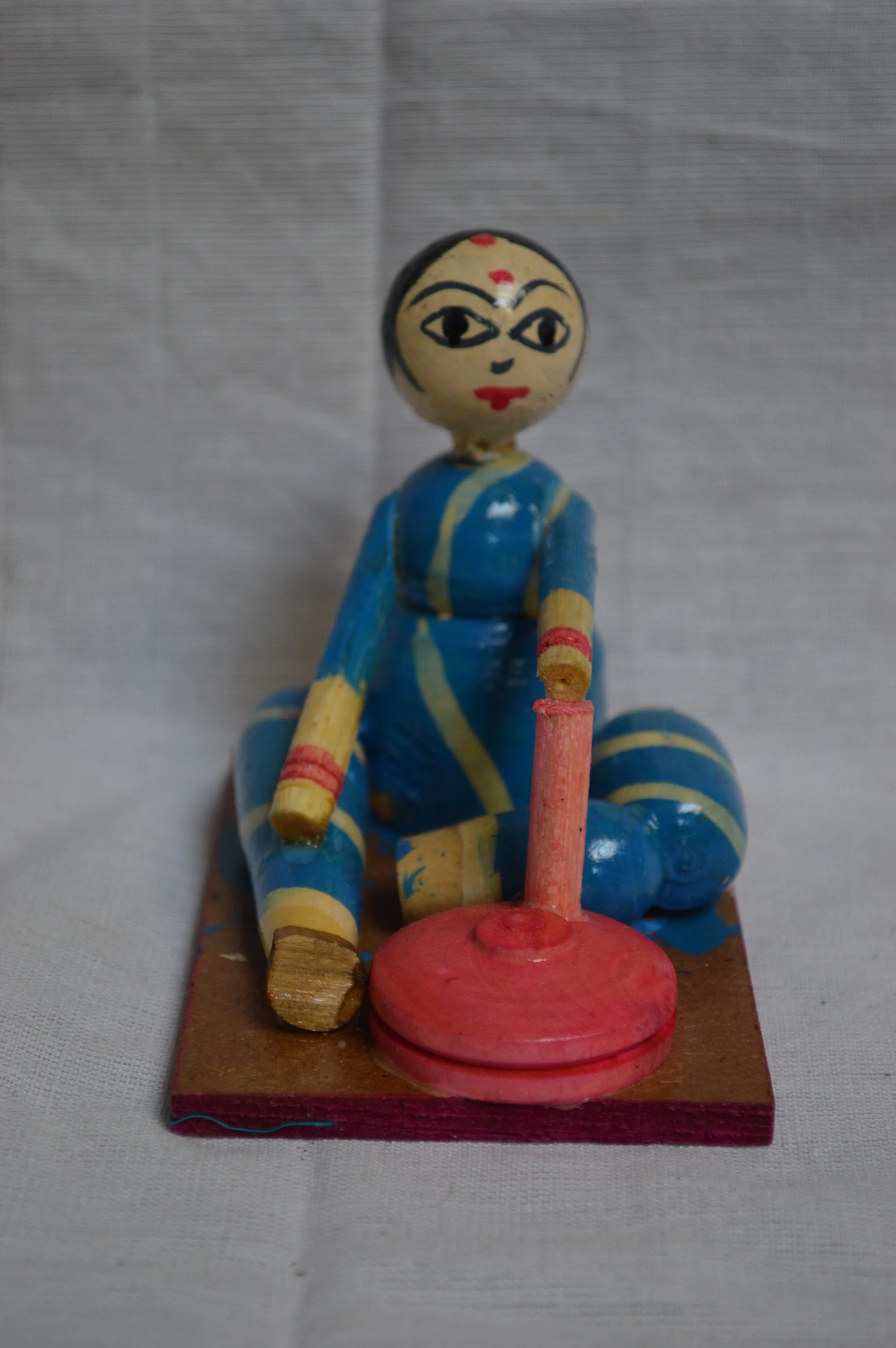 Village woman making flour