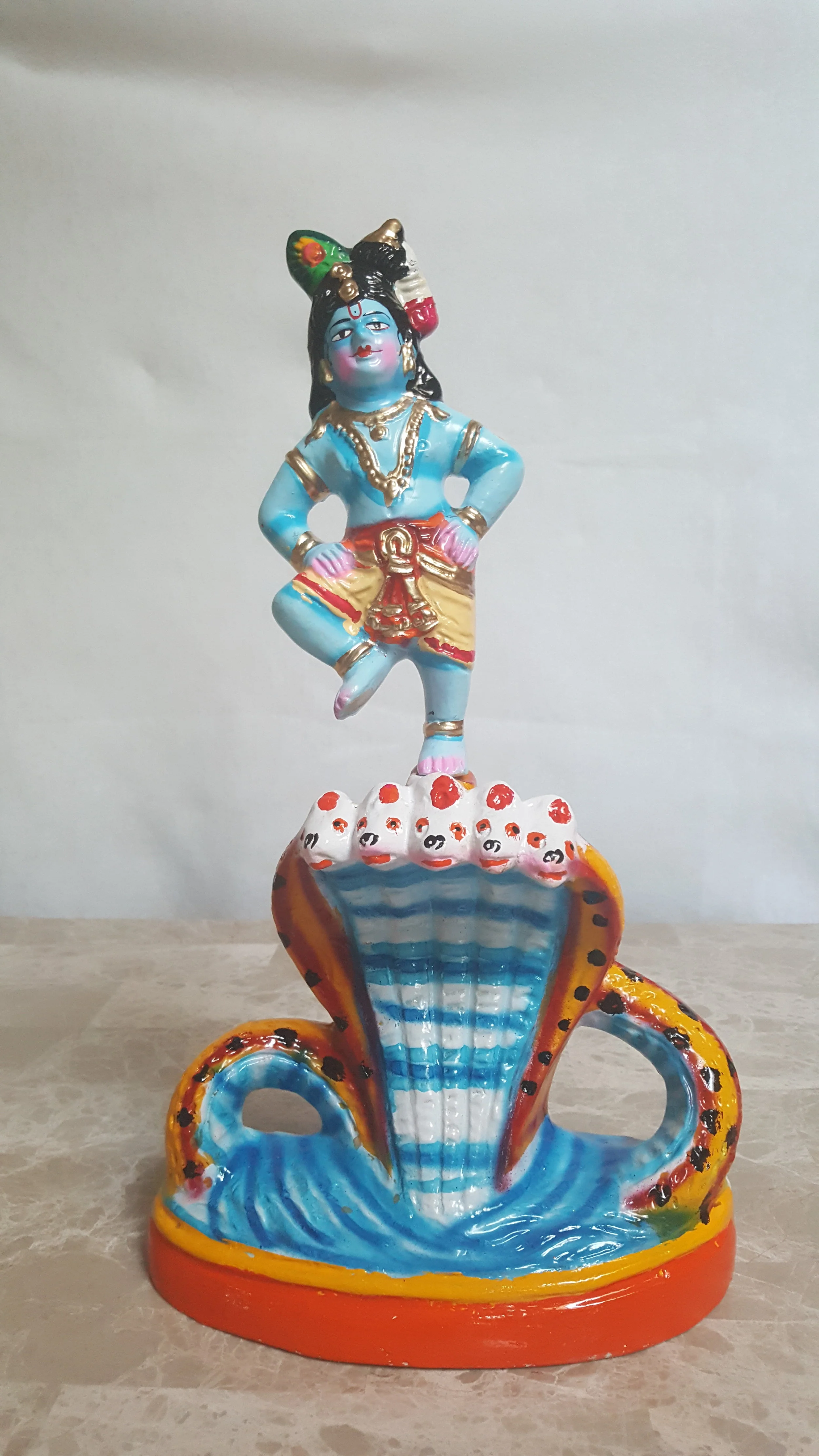 Young Krishna on Kalinga - Papermache
