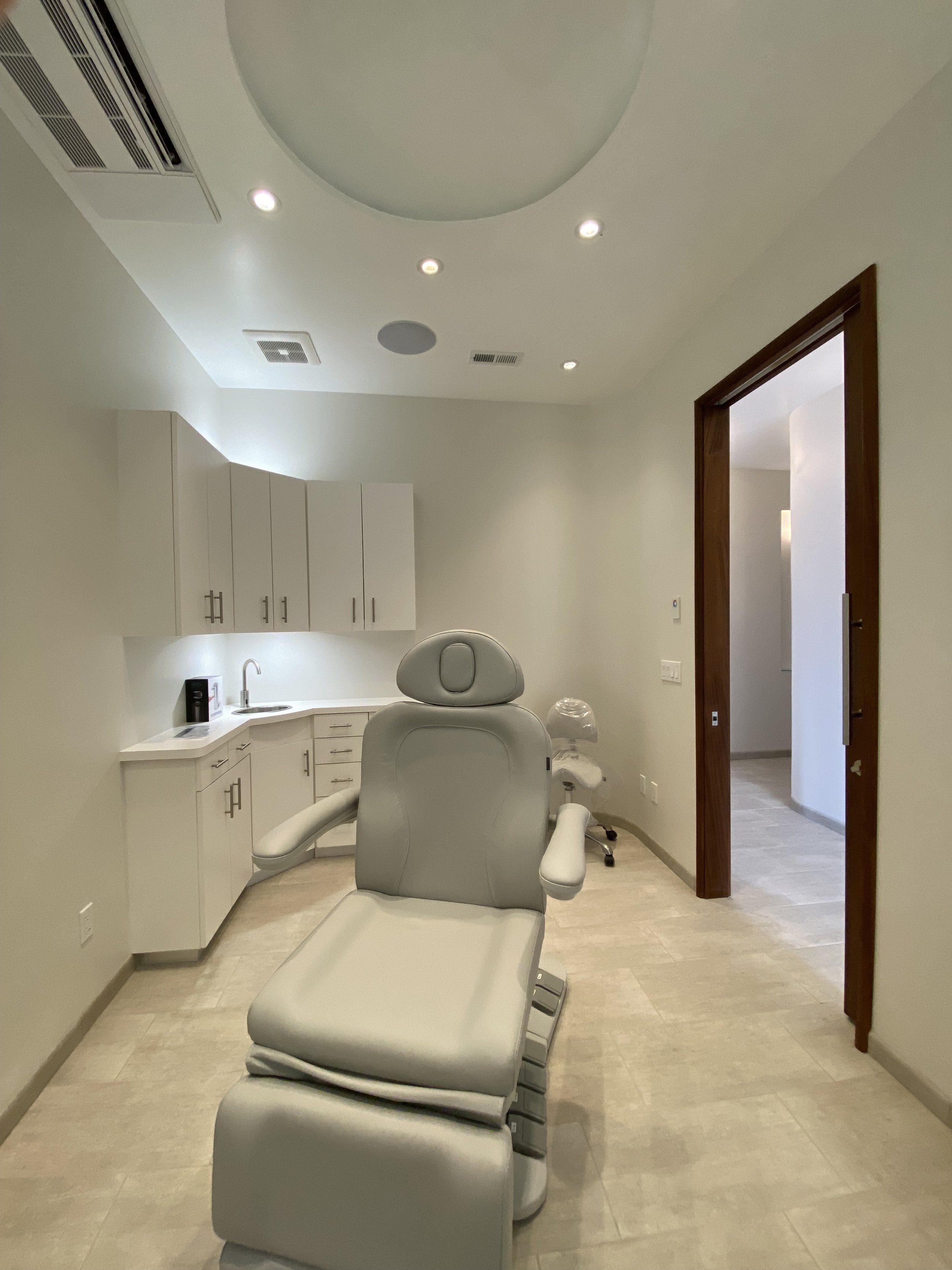 Treatment room with soffit ceiling