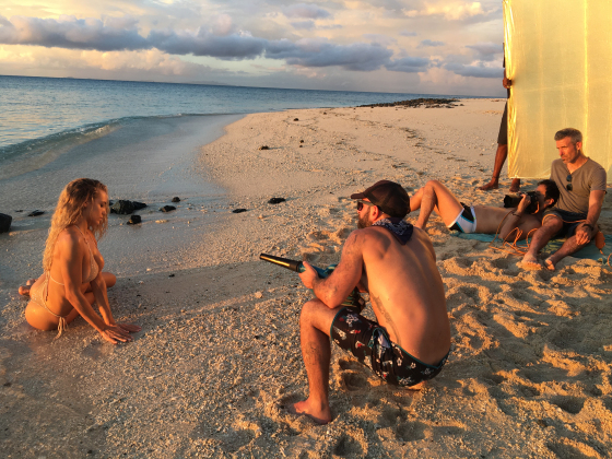 A reflector (on the right) bouncing gold light into model Hannah Ferguson