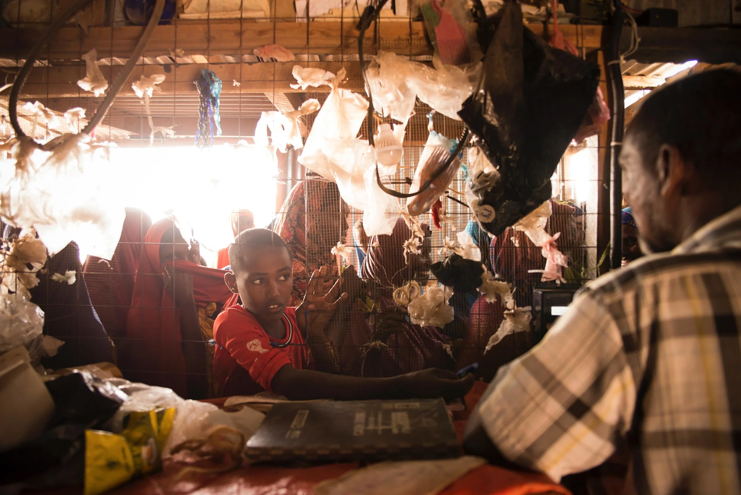 A boy waits to top-up his credit for the Water ATM in Hadado town in Northern Kenya.