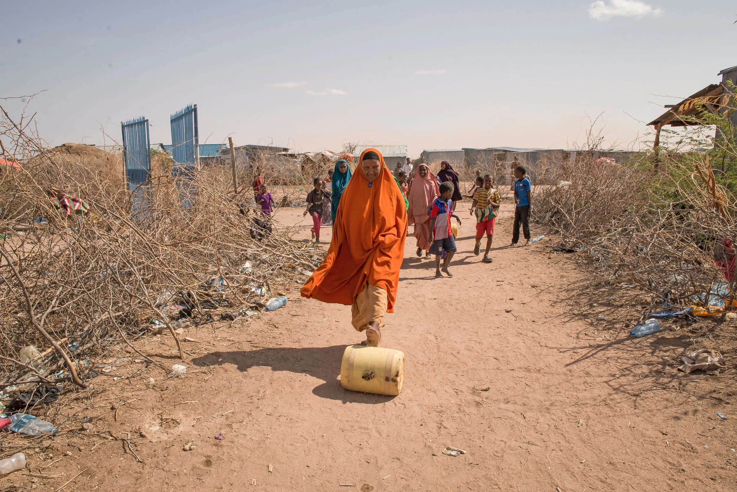 Bishara Abdi Iladir, 53, rolls a barrel of water to her home in Northern Kenya. The price of water has skyrocketed in the Horn of Africa due to an ongoing drought in the region. Thankfully, Oxfam provides access to prepaid Water ATMs in drought stricken areas that keep water prices fair and consistent for Iladir and her 30 children and grandchildren.