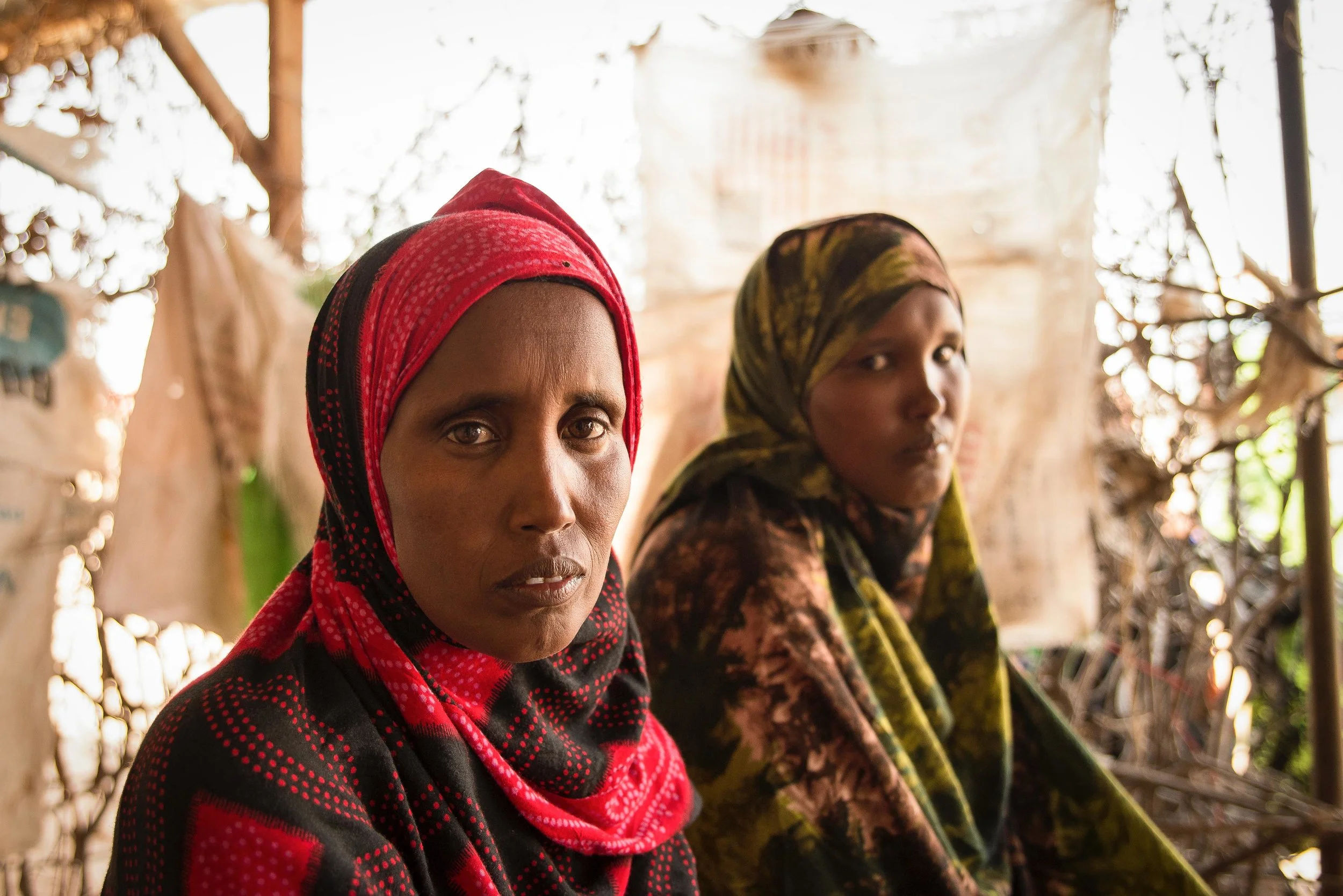 Sisters Kadija and Aminda Hussein rest at a shop in Hadado town in Northern Kenya. The two sisters said they are struggling to feed their children due to the ongoing drought in the region.