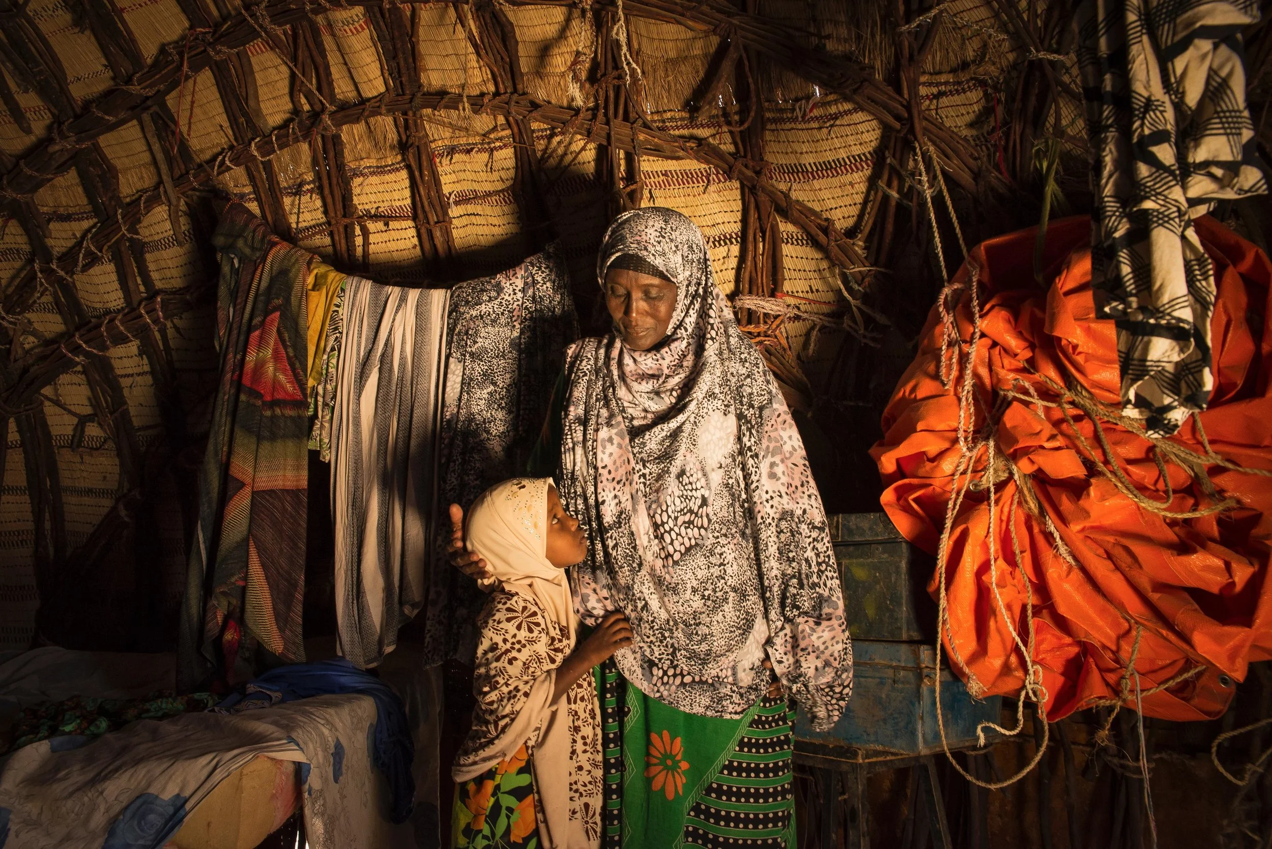 Samey Alasow, 50, and her daughter sit inside their thatched-roof home in Hadado Town in Northern Kenya. The ongoing drought in the Horn of Africa forced Alasow’s husband to take their livestock to lusher land in the east, leaving her and her daughter to fend for themselves in Hadado. That was eight months ago. They haven’t heard from him since.