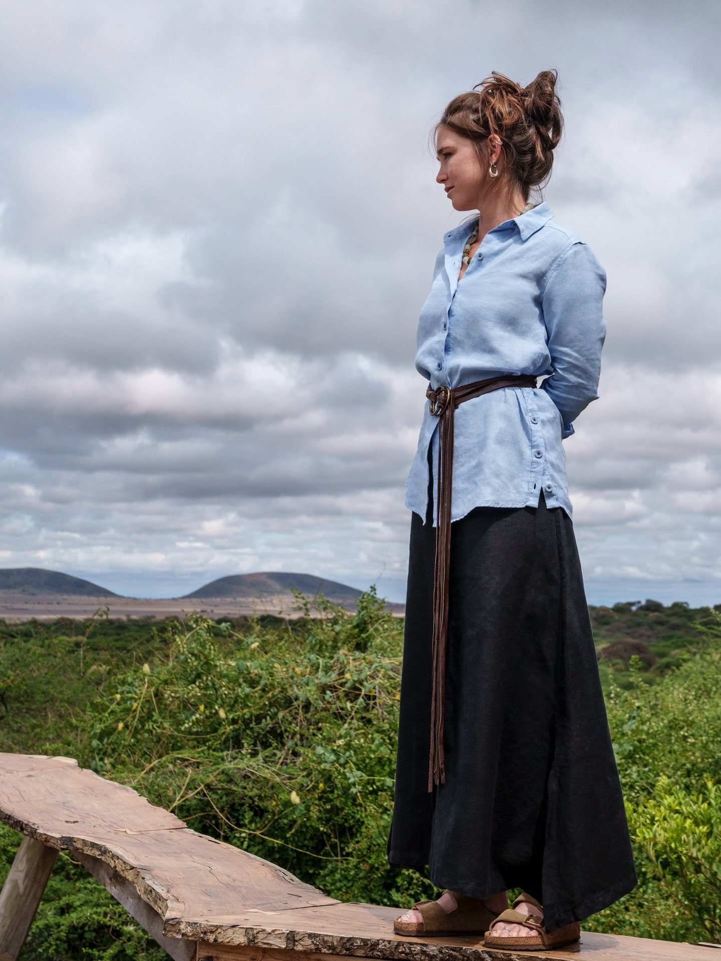 Laura, taking in the beauty of Ol Donyo Lodge...
d&amp;b Clothing: Domenique Casual Shirt in Sky, Ladies Lindbergh Skirt with Pockets in Black, Susan Tassel Belt in Brown Leather.
Model: @laurahutch._ 
Photographer: @beverlyjoubert 
Kenya: @greatplai