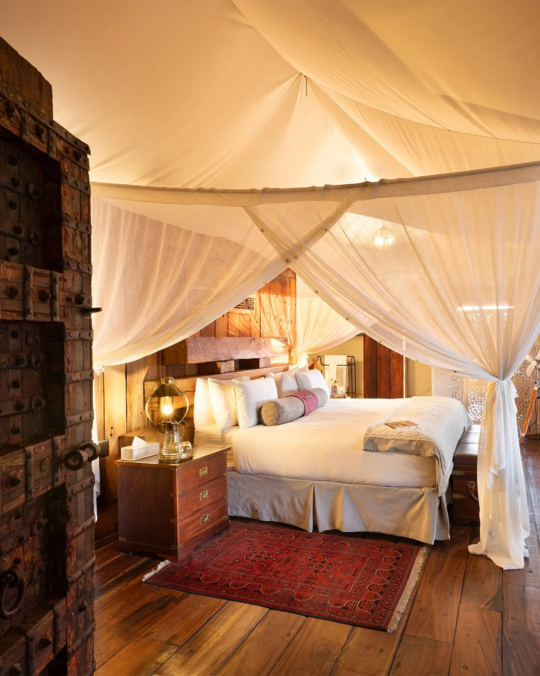 Step through the hand-carved Zanzibar door and into another world. Deep crimsons, rich leather, polished hardwoods, every detail at Zarafa Camp is carefully curated and built as though it's an extension of the incredible landscape on which it rests.
