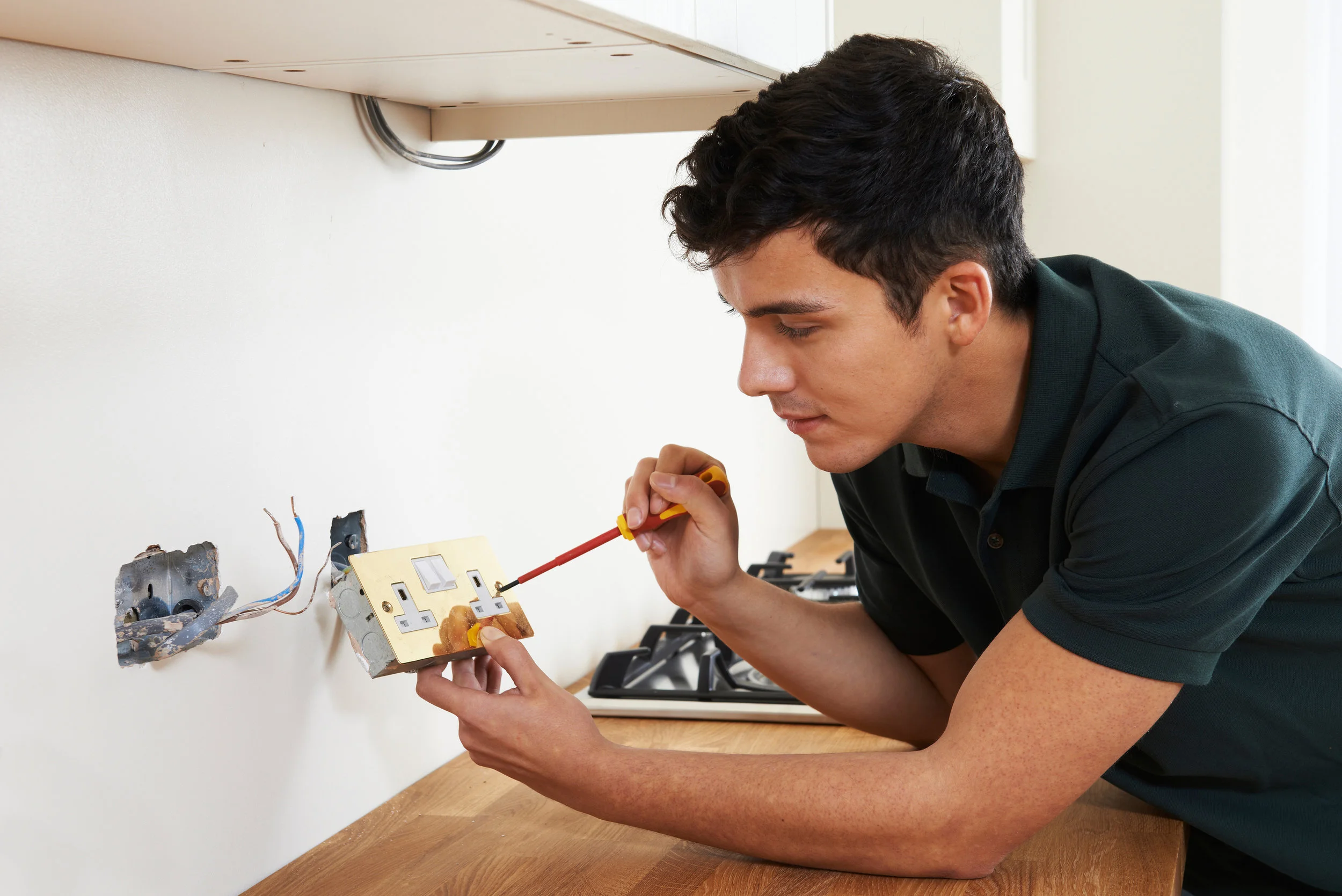 Electrician Installing Socket In New House.jpg