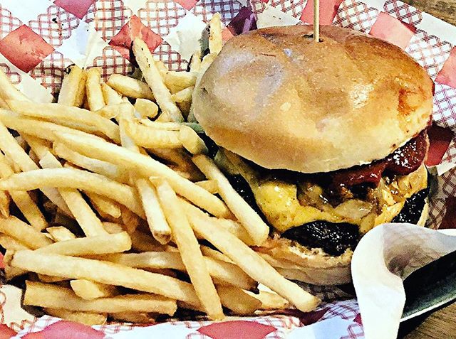 The tasty Cowboy burger had juicy meat, a soft bun, cheddar cheese and caramlised onions all served with lovely shoestring fries at Surly&rsquo;s in Surry Hills Sydney #burger #beef #bun #cheese #sirandmladyinvited #onion #delicious #tasty #dinner #c