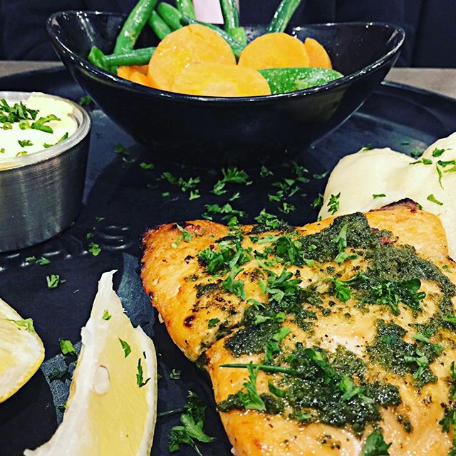 This salmon fillet with fresh herb chimichurri and Hollandaise sauce was cooked perfectly - with a lightly crisped top revealing tender juicy flesh - at Rashays in Punchbowl Sydney #salmon #vegetables #mash #restaurant #sirandmladyinvited #fish #eat 