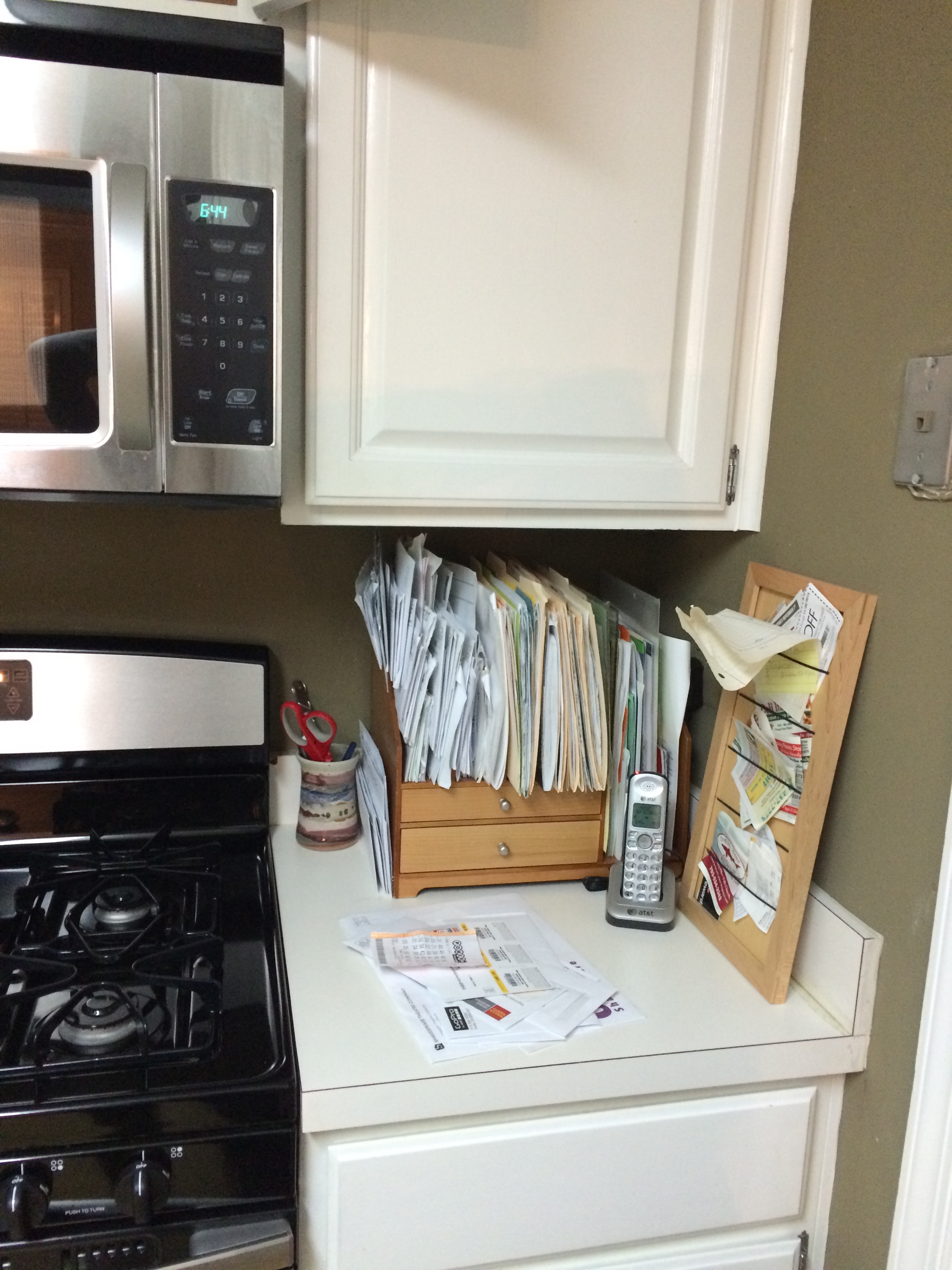 Before, this was the extent of workspace in the kitchen. By removing the wall to the right and extending the counter and cabinet storage, the kitchen is now open and airy.