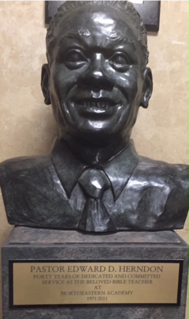 Bust dedicated to the memory of Pastor Edward D. Herndon which stands at Northeastern Academy. 