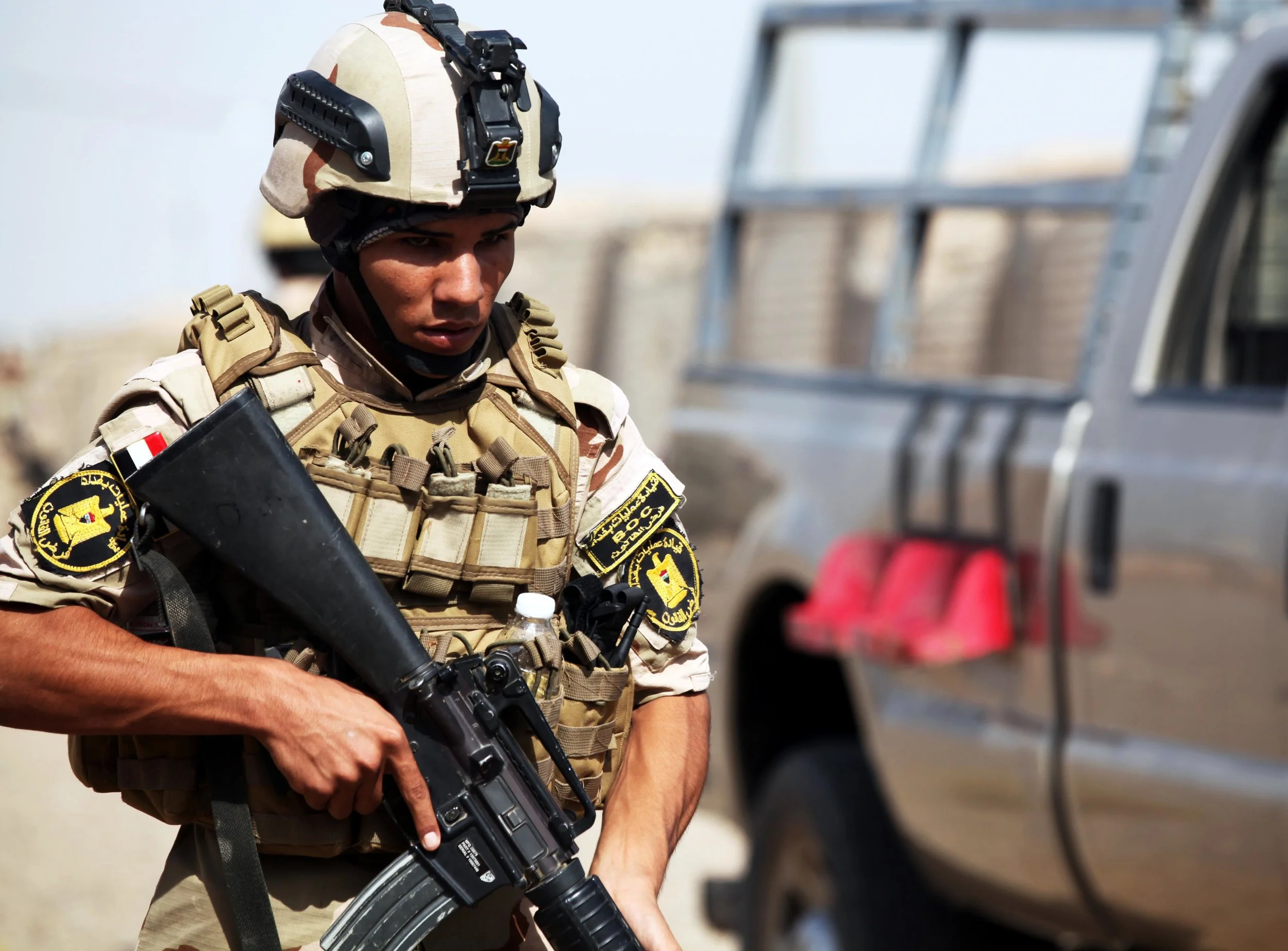 CAMP TAJI - An Iraqi soldier with the 34th Armored Brigade provides security during personal security detail training at Camp Taji, Iraq, July 26, 2016. "he appearance of U.S. Department of Defense (DoD) visual information does not imply or constitute DoD endorsement. Photo By: U.S. Army Sgt. Joshua E. Powell