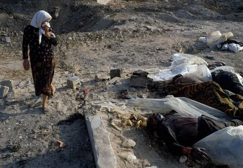 © Chris Steele-Perkins/Magnum Photos: Lebanon. Beirut. Inside the camps of Sabra and Shatila, where Red Cross units help to clear away the decomposing bodies of the massacre by the Phalangist military units against Palestinian refugees. 1982