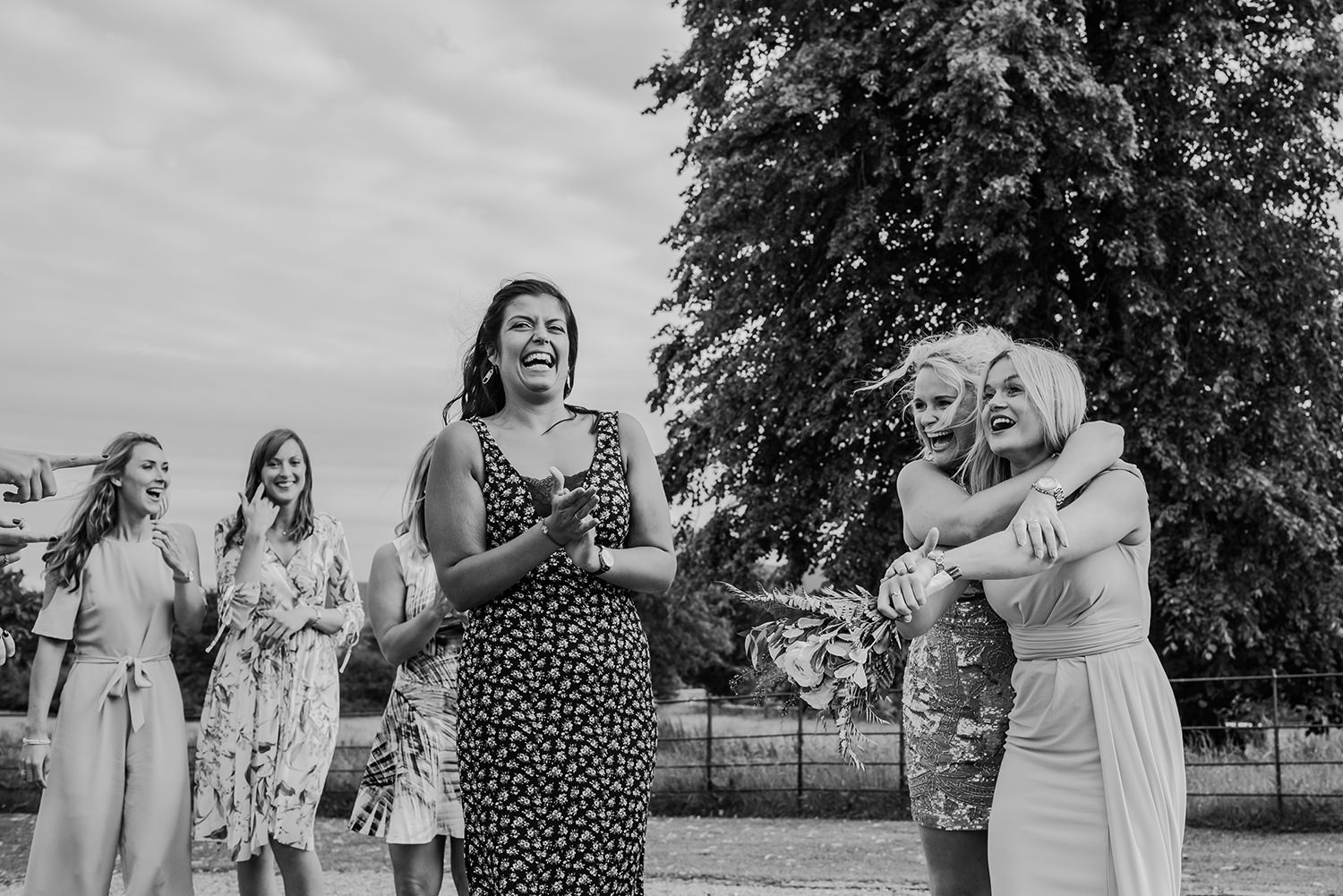  black and white photo of girl who caught flowers 