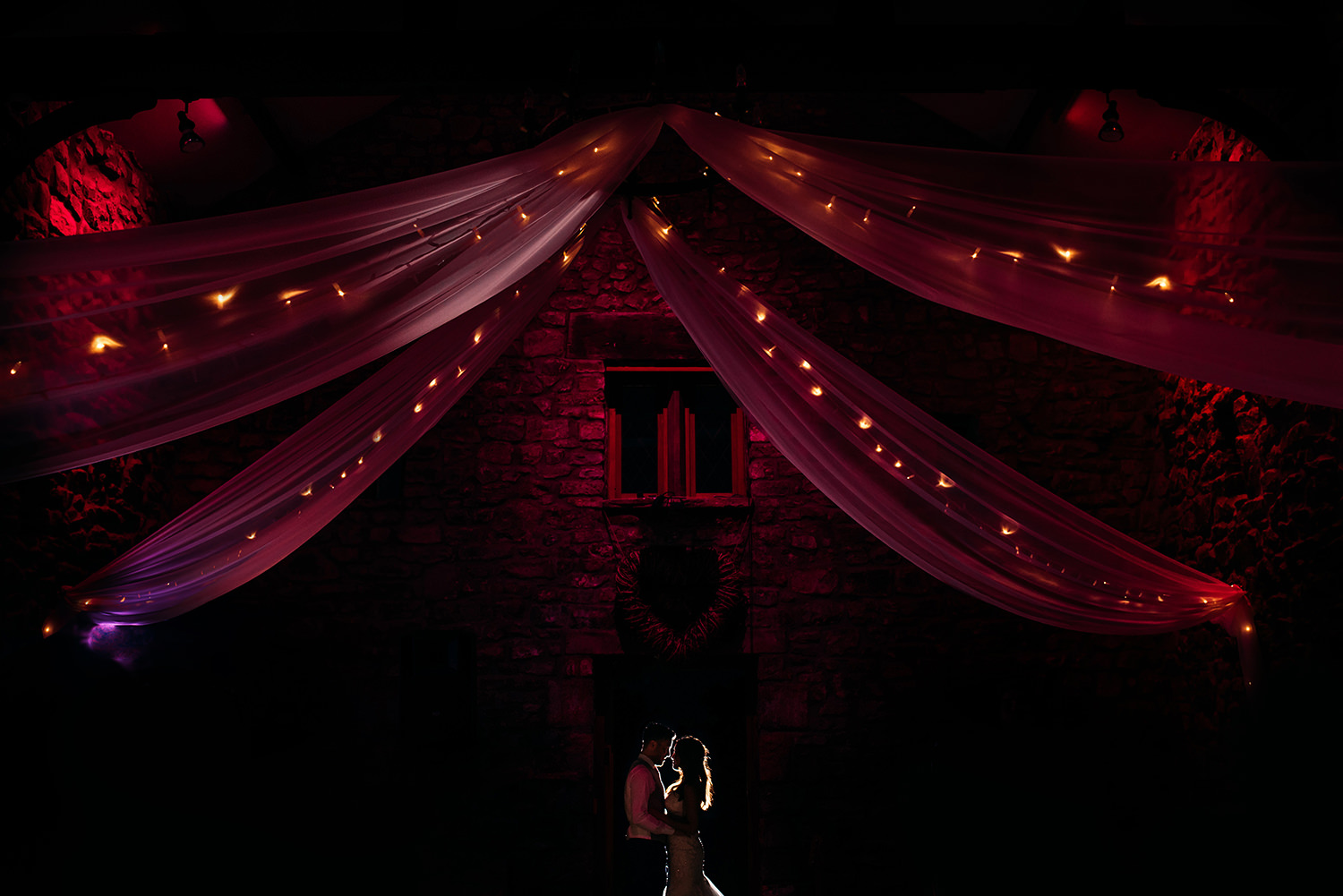  colour photo of bride and groom at night 